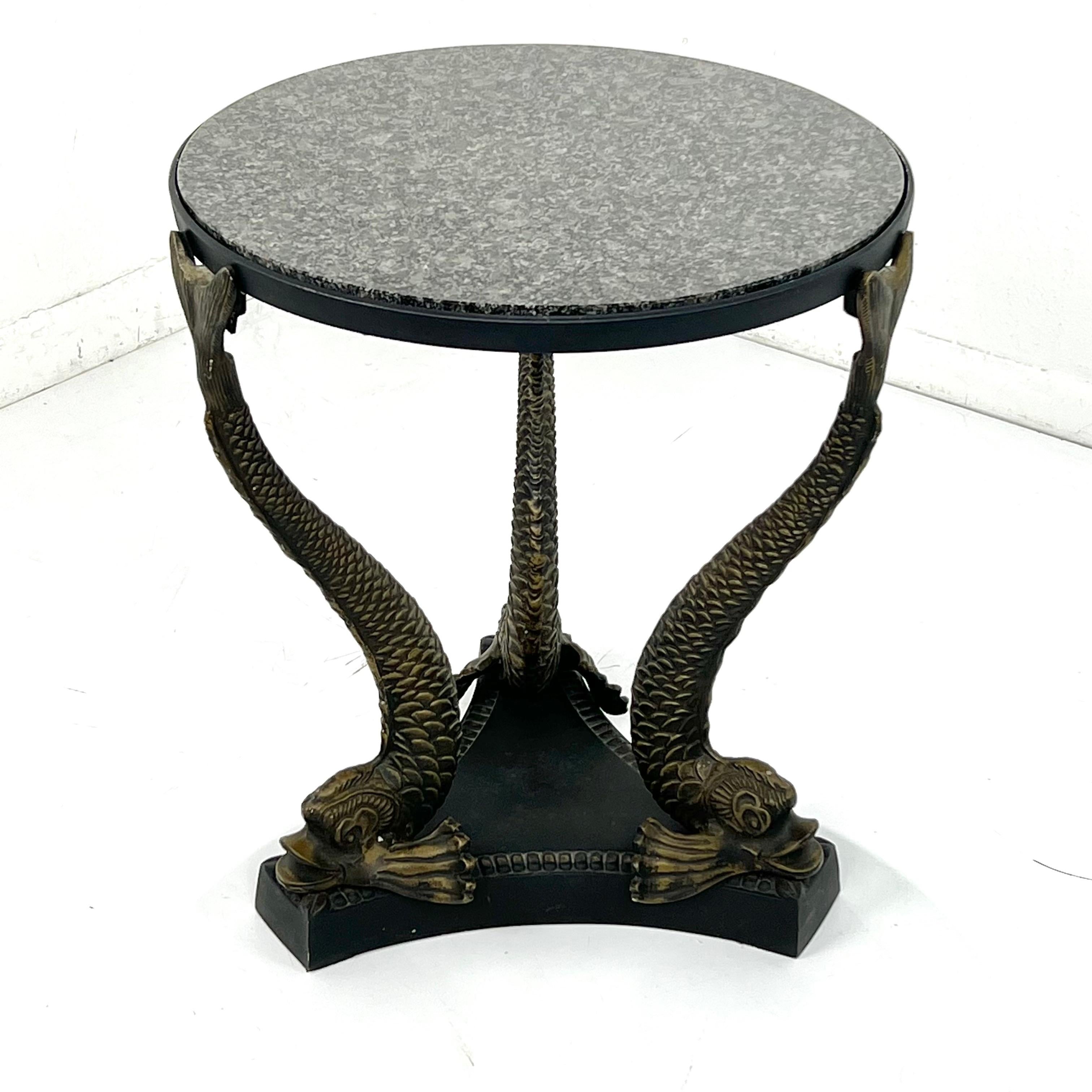 Vintage bronze dolphin leg occasional table with round black marble top. 