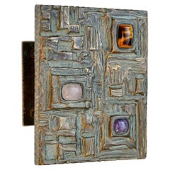 Maniglia per porta in bronzo con pietre semipreziose e rilievi astratti