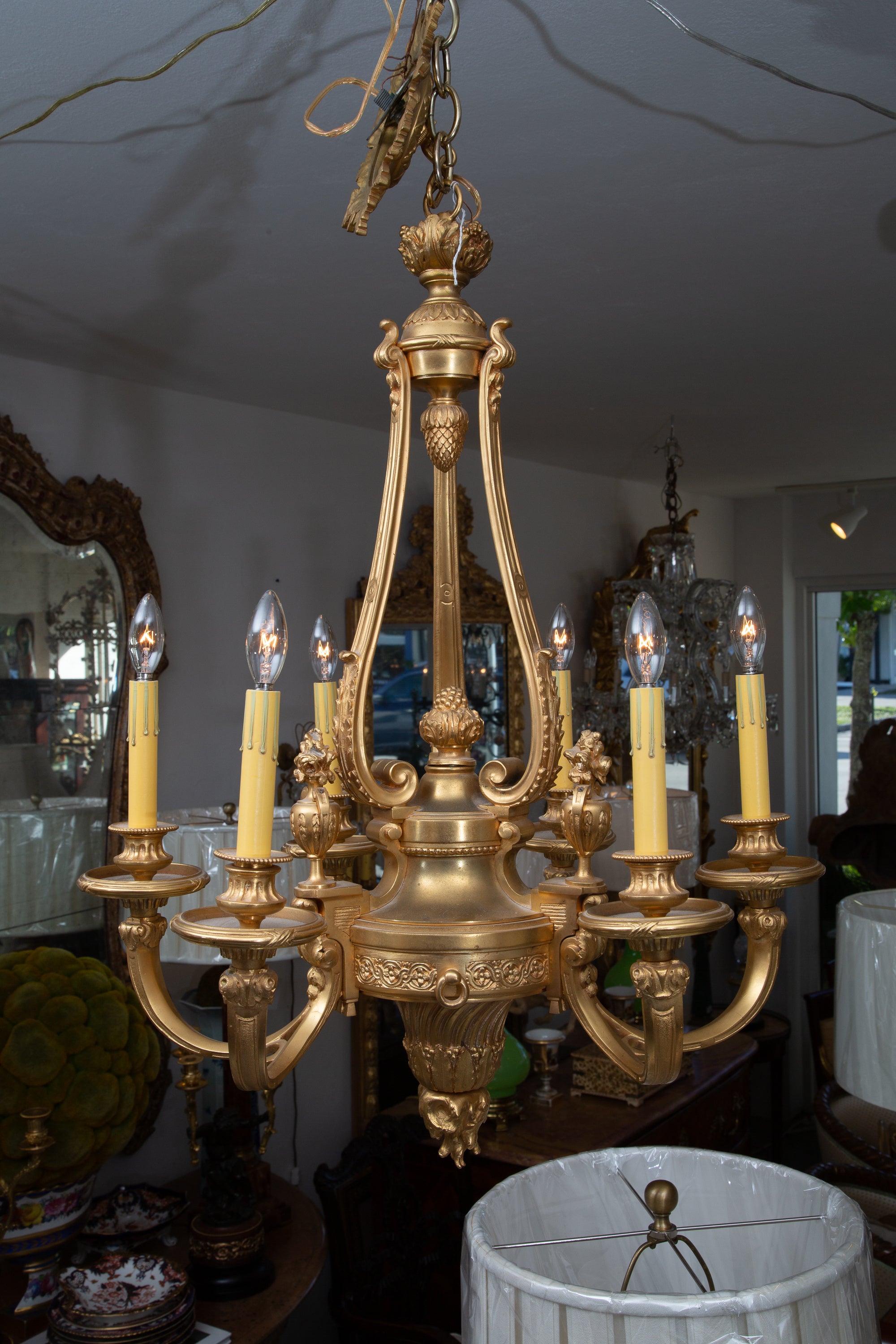 This is a graceful six light glit bronze French hanging chandelier. Simple, yet sophisticated.