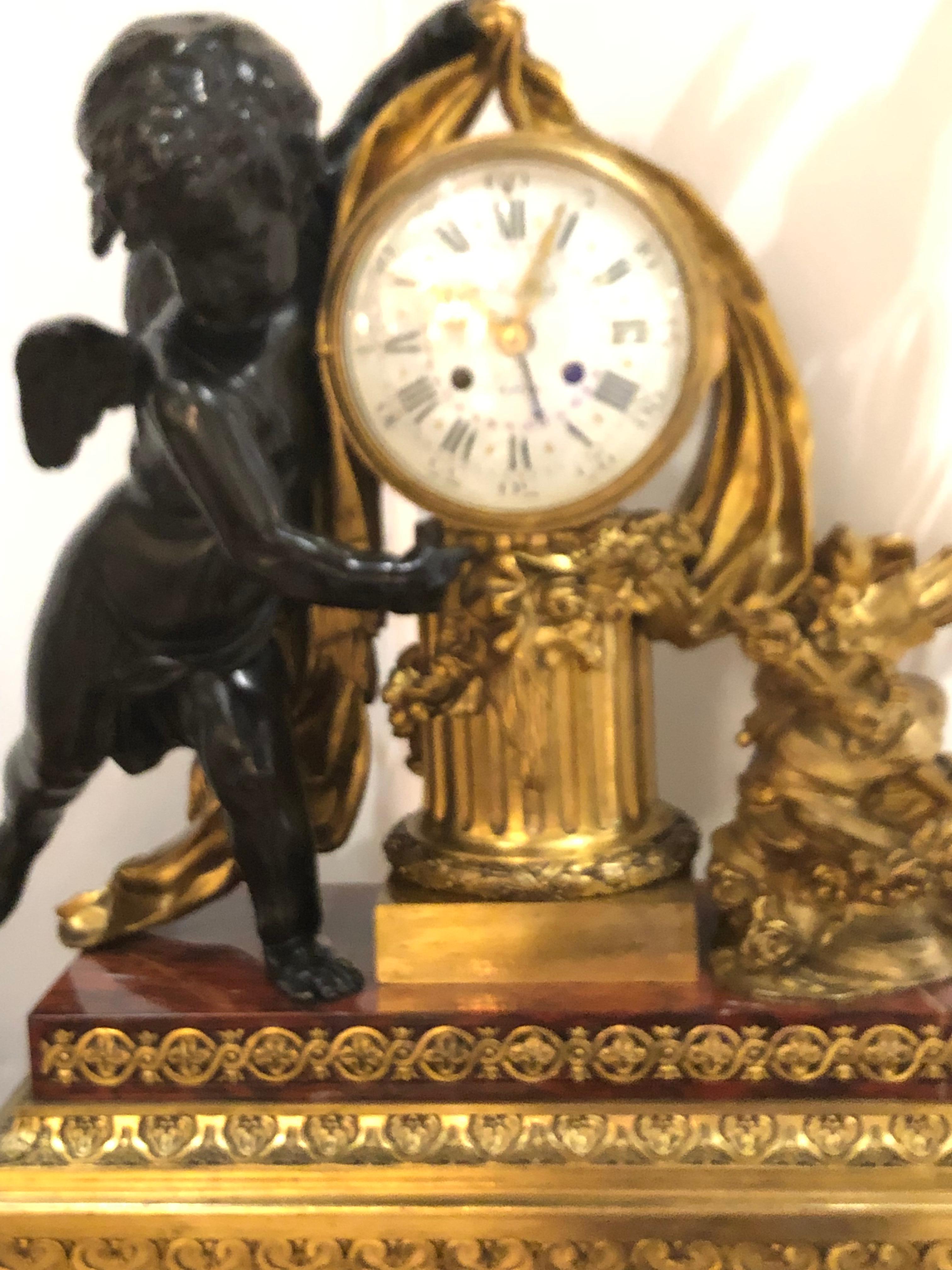 French Bronze Doré and Rouge Marble Clock Garniture Set by Ferdinand Berthoud For Sale