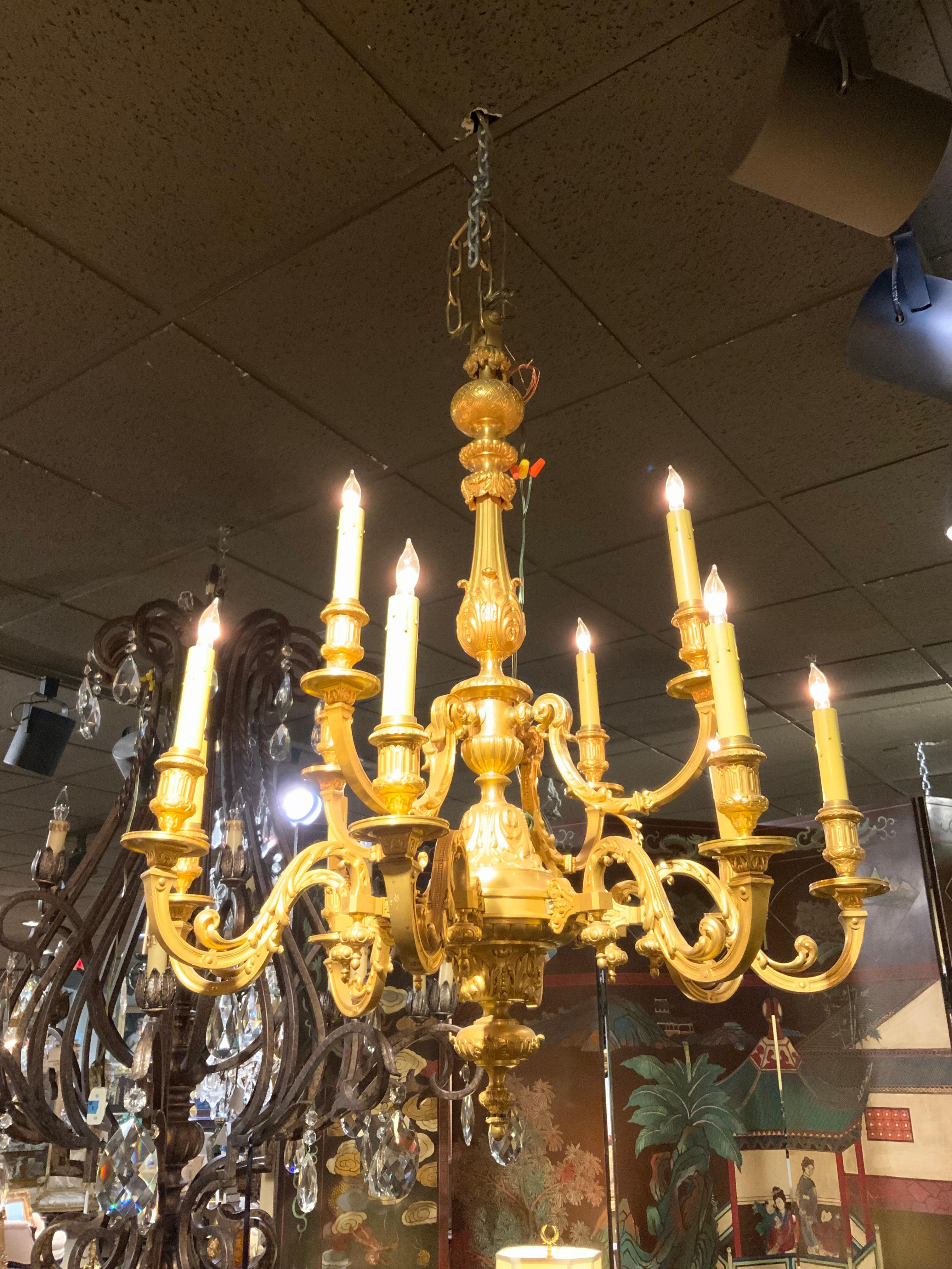 This chandelier has fine definition because the casting of this
Bronze is very fine quality. The gilding on this piece is brilliant
And shows no wear. The scrolling arms are gracefully with an
Open wide spread. The wiring is good and it is ready