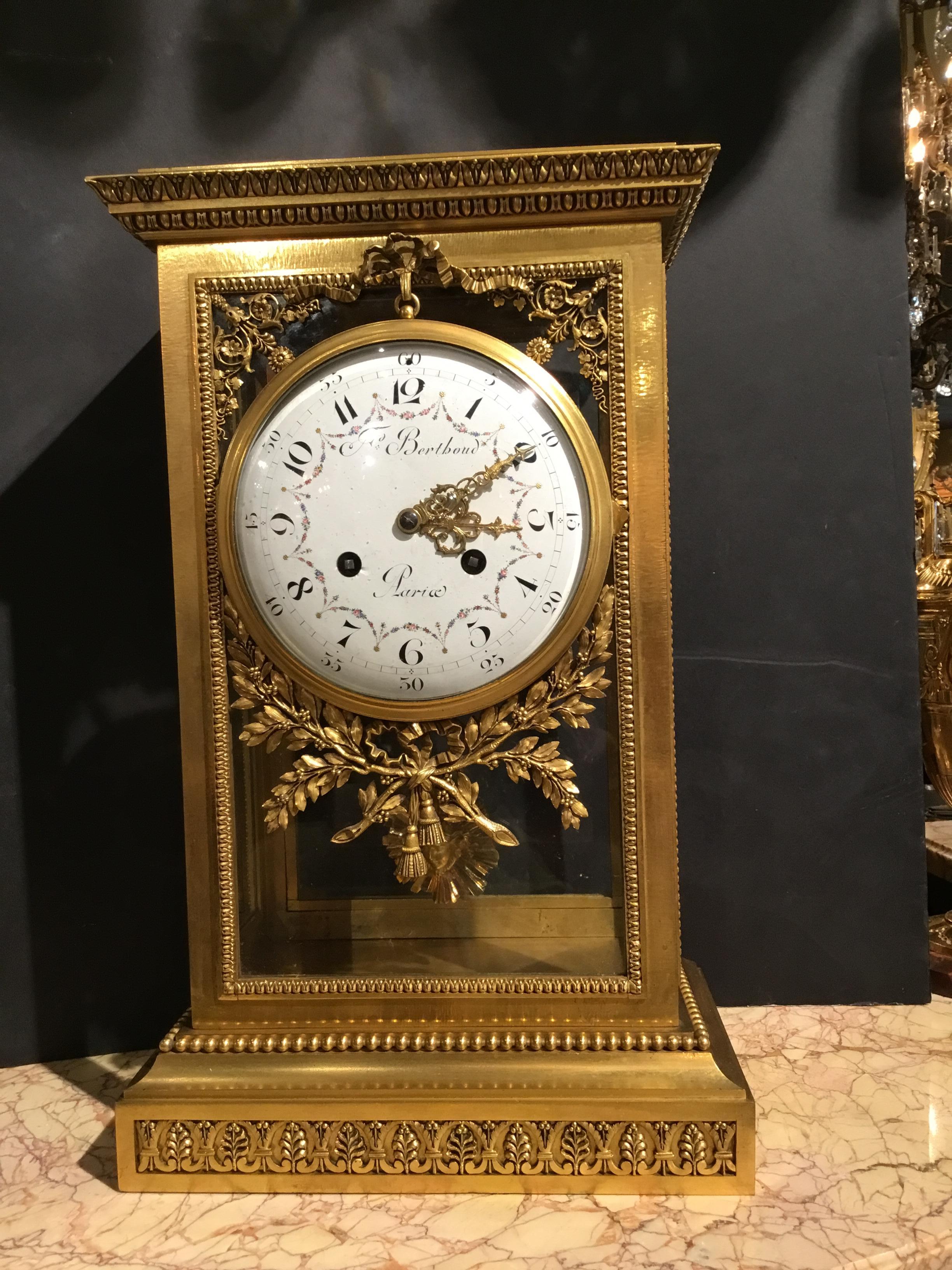 Gilt bronze mantel clock with white enamel face painted with delicate painting
Of pink and green garlands. Front face signed F Berthoud Paris. Glass and
Bronze dore case that is glass on all sides. Bowsand floral embellishments
Adorn the front