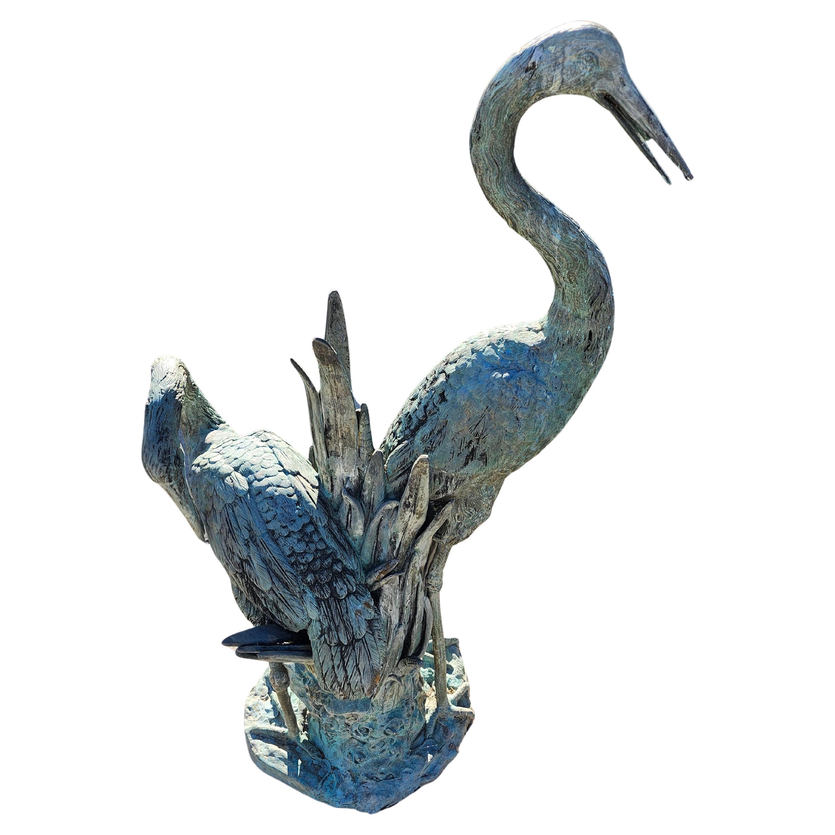 Fabulous cast bronze double fountain with a water source from each bird. Water flows out from each birds beak. Exquisite castings in an aged verdigras patina. In excellent vintage condition with normal wear from age and use. 