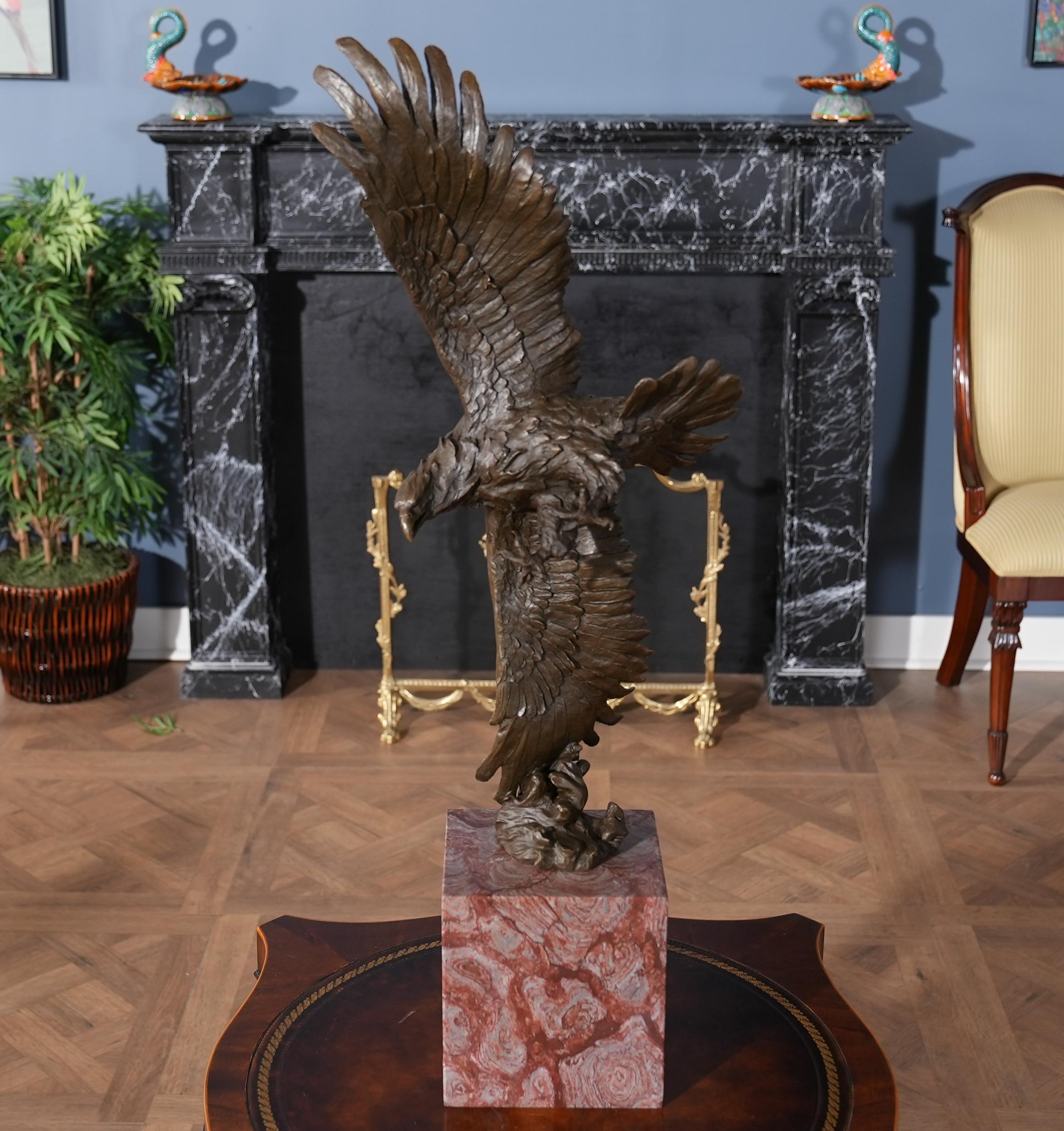 Graceful even when standing still the Bronze Eagle in Flight with Marble Base is a striking addition to any setting. Using traditional lost wax casting methods the Eagle in Flight statue is created in pieces and then joined together with brazing and