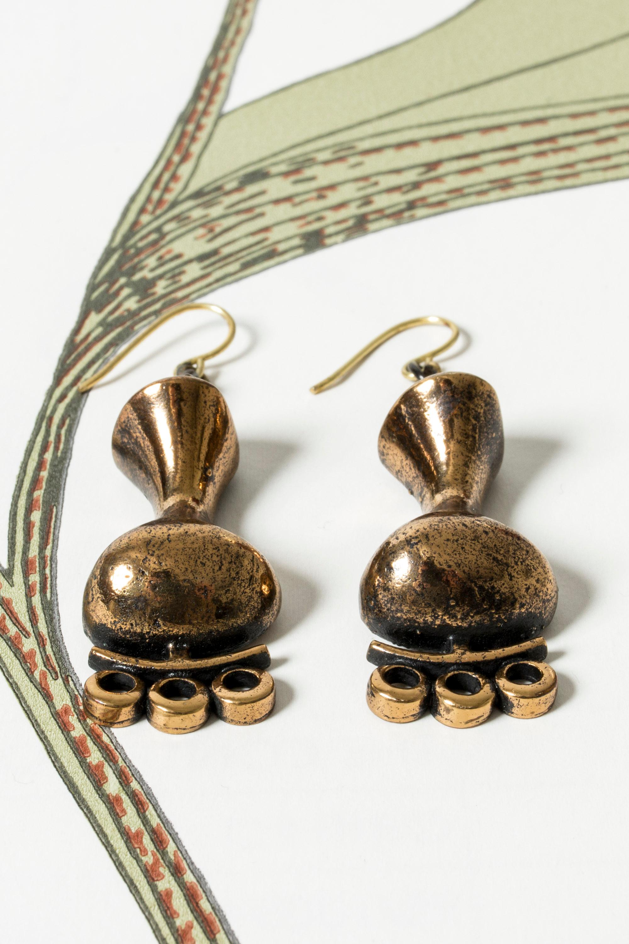 Beautiful bronze earrings by Jorma Laine, in an imaginative, enigmatic design characteristic of Laine’s later work.