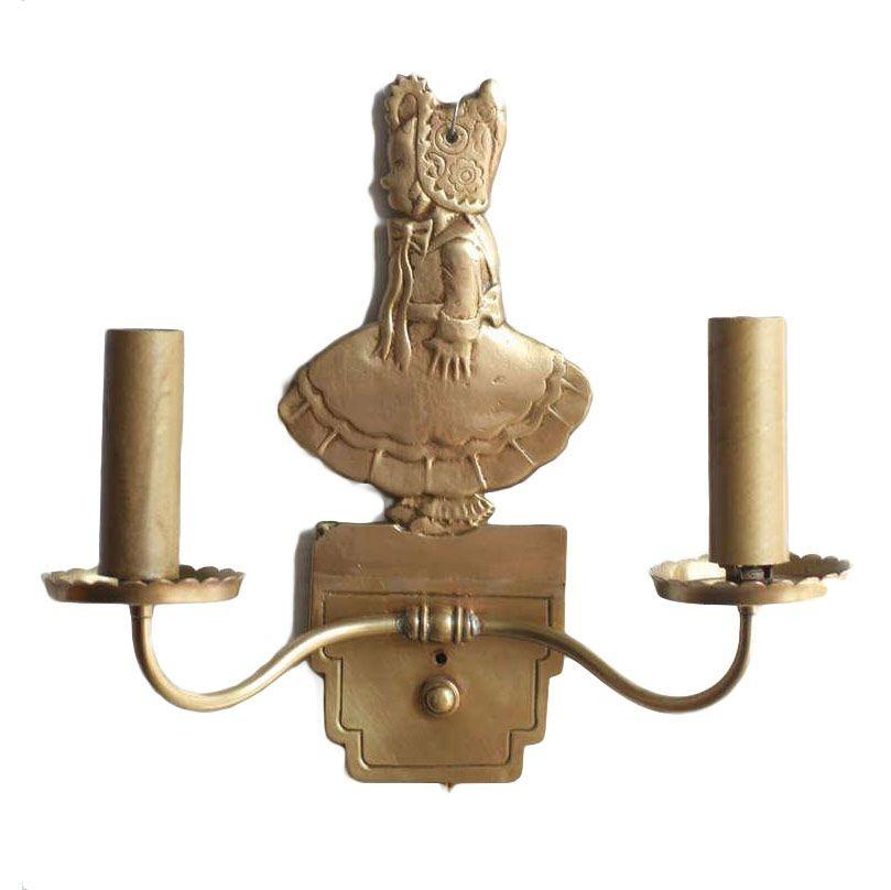 Pair of vintage circa 1947 solid bronze electric candelabra wall sconces featuring a young girl in bonnet used in the 1947 film Miracle on 34th Street.
 