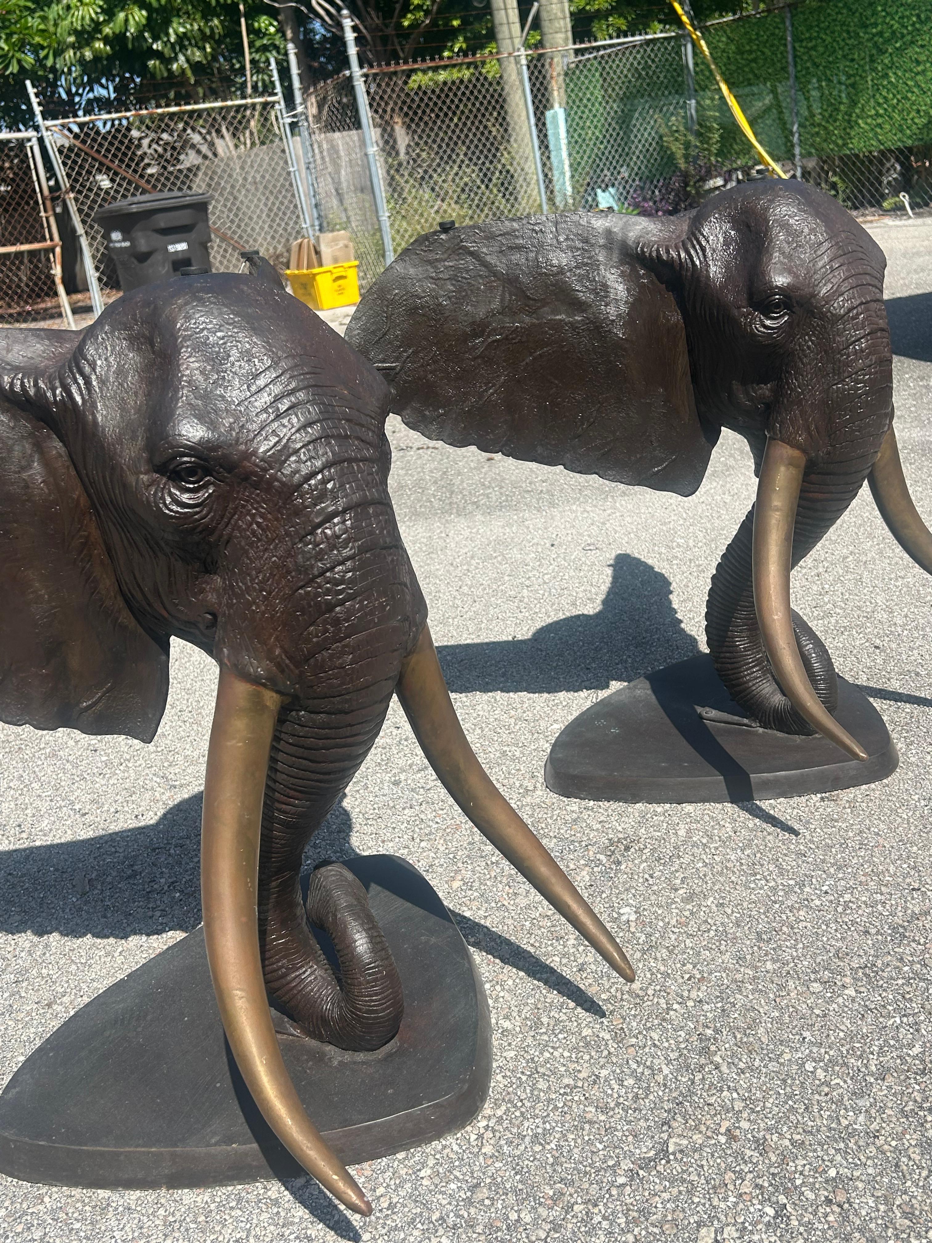 A cast full head bronze, elephant, head with tusks, wonderful eyes, incredible detail, skin wrinkles, large supportive ears, and exceptional patina. Please see photos…we have two available. This listing is for one. By using two, you can create a