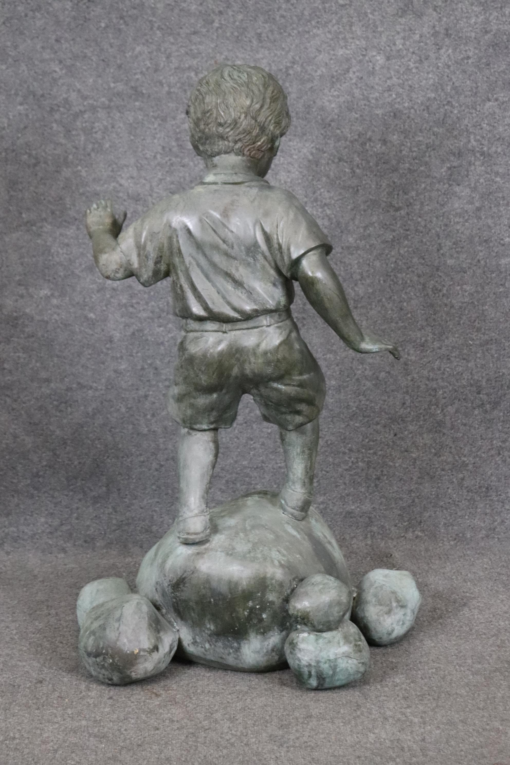 Late 20th Century Bronze Elite by Henre in Verdi Gris Outdoor Statue of a Young Boy on a Rock For Sale