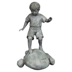 Bronze Elite by Henre in Verdi Gris Outdoor Statue of a Young Boy on a Rock