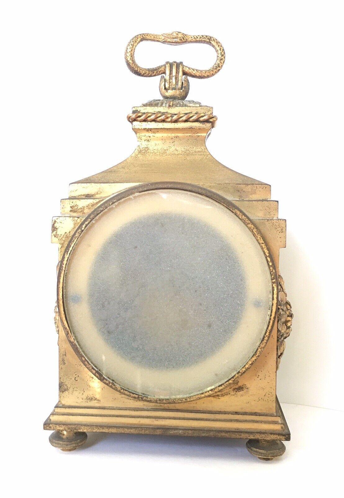 Pendule de cheminée Empire en bronze Grenon France Design Uroboros Bon état - En vente à Los Angeles, CA
