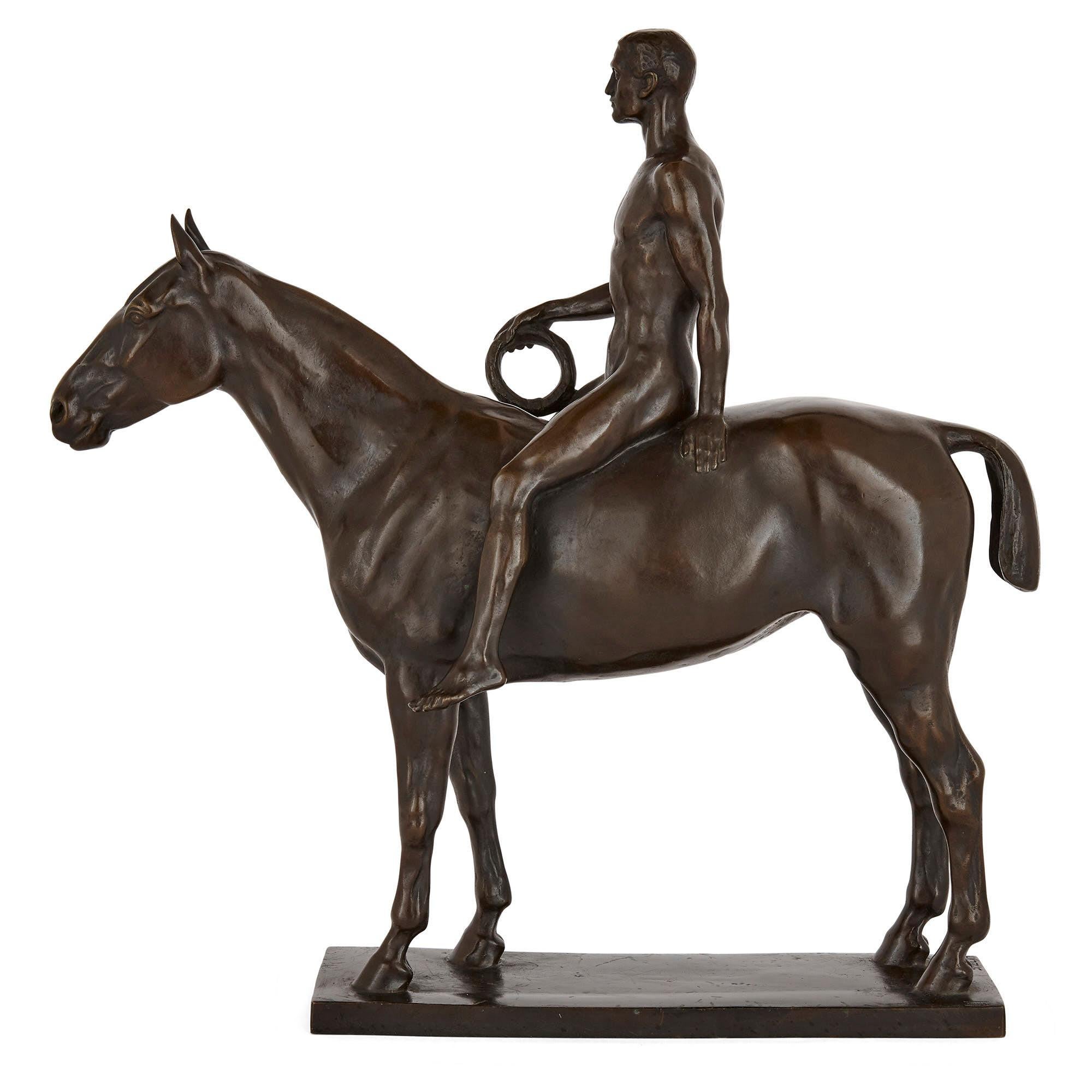 Known as the ‘Olympic Rider’, this patinated bronze group of a man upon a horse is by the German artist Heinrich Splieth. The design is simple yet restrained and refined: an ideal man portrayed in the nude, holding a laurel wreath, is seated on a