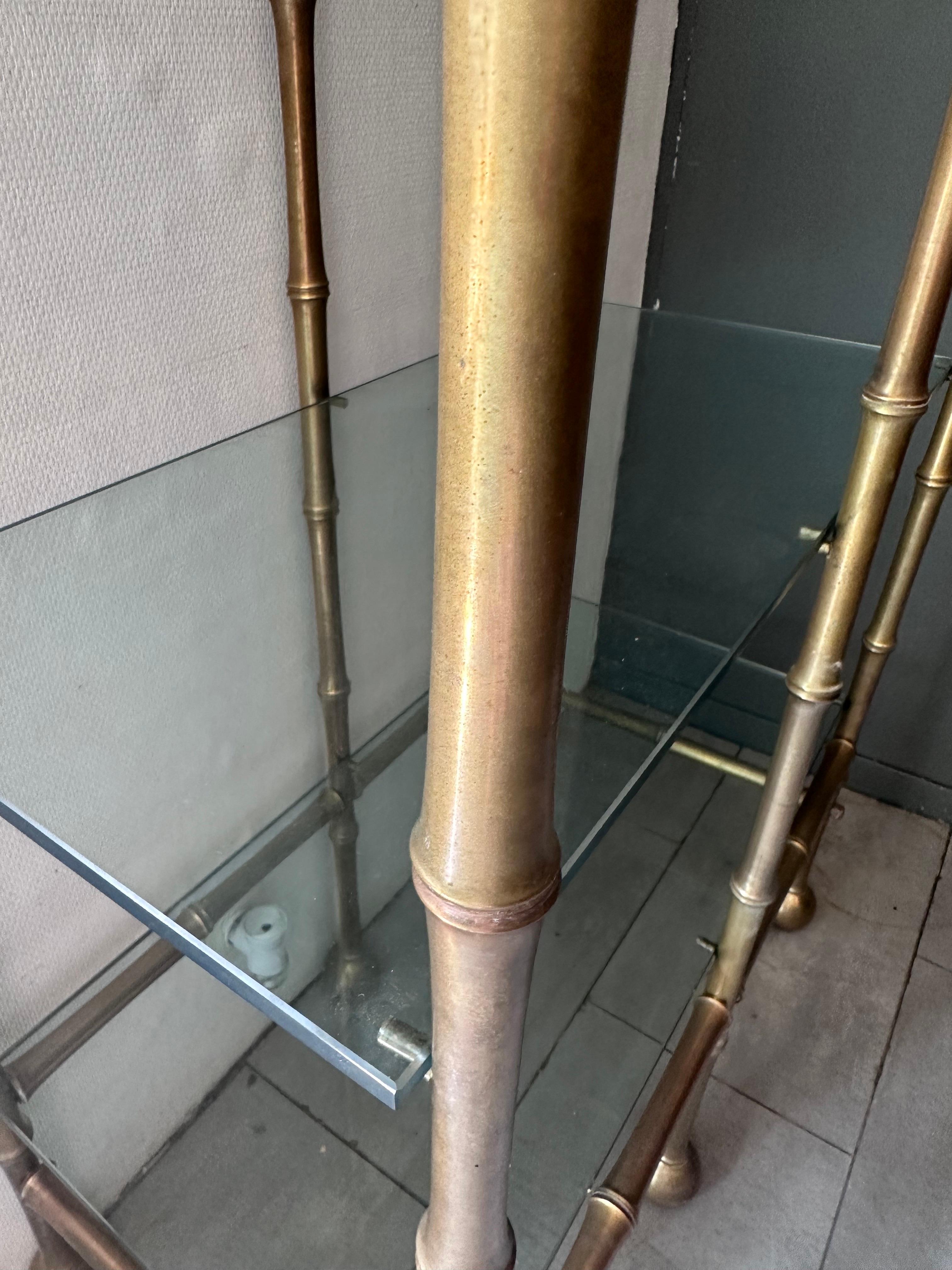 Amazing bamboo shaped bronze bookcase from the seventies.
4 glass shelves.
Great quality and condition. 
