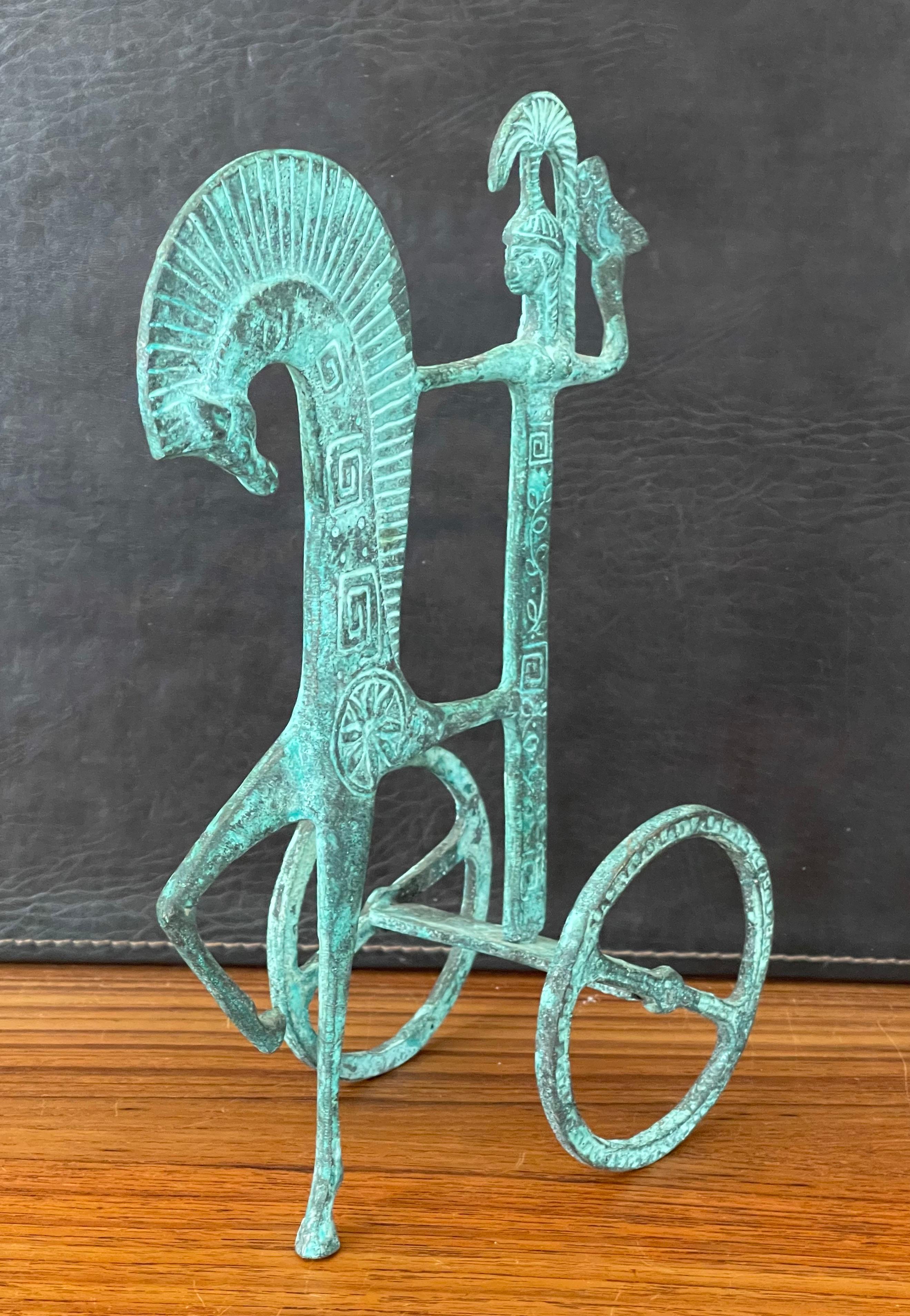 Simple and elegant Etruscan bronze horse and chariot sculpture in the style of Frederick Weinberg, circa 1970s. Minimalist and modern, an ideal midcentury piece decorative piece that has a wonderful verdigris finish. The piece is in very good