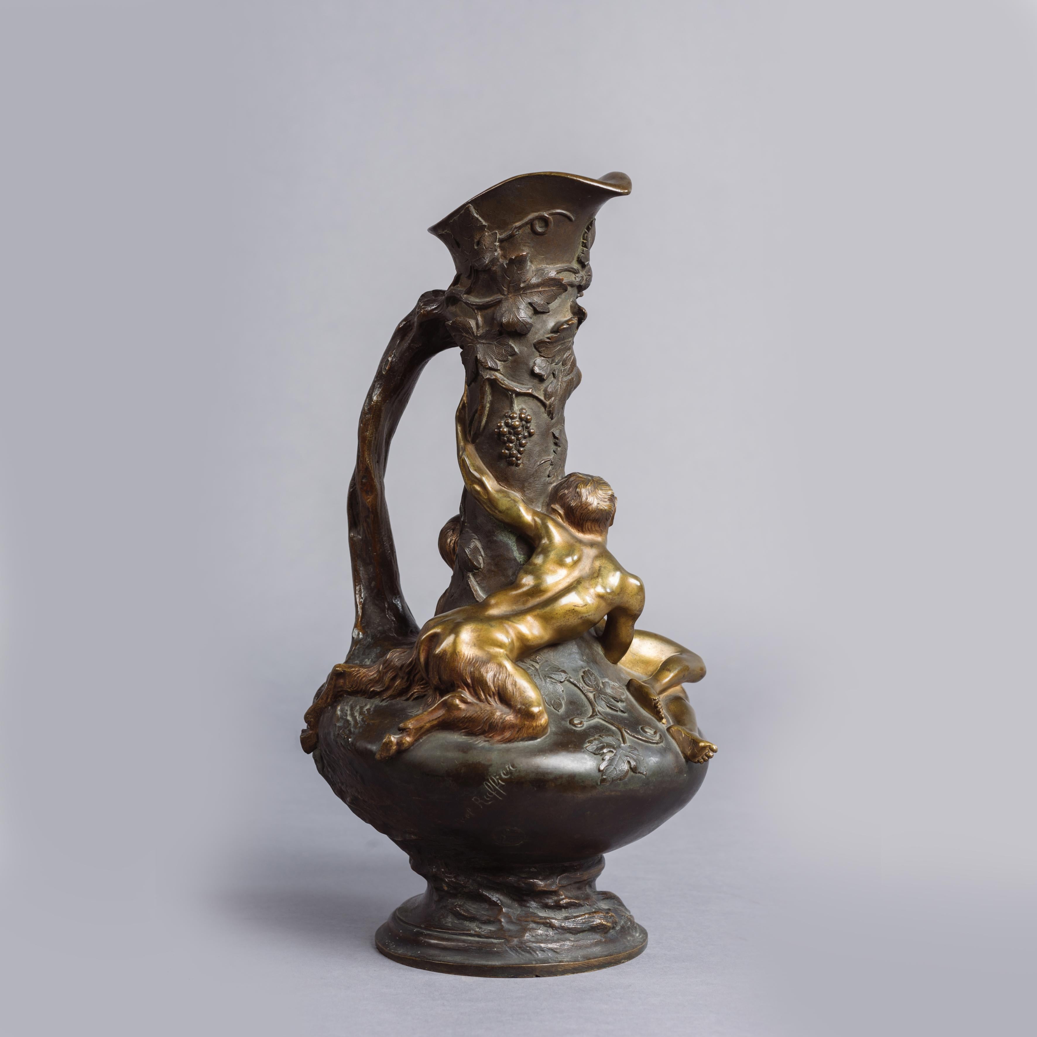 A fine patinated bronze ewer depicting a Satyr and Naïade by Noël Ruffier.

Signed to the bronze 'Noel Ruffier'. 

Finely cast in high relief with a classical female Naiade and a Satyr figure amongst grape vines, the handle of the vase in the