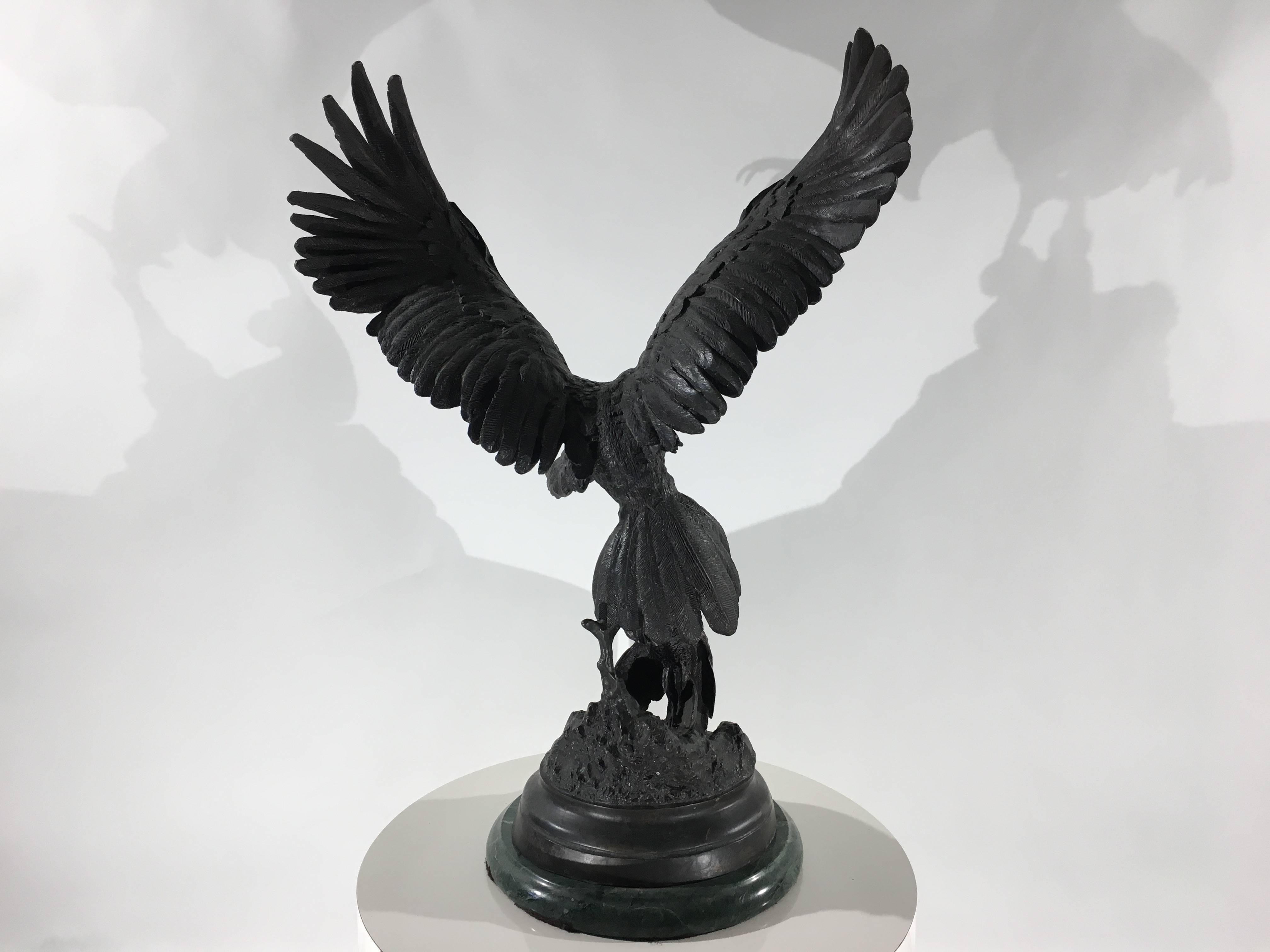 Jules Moigniez (1835-1894) was a French artist especially known for his highly-detailed sculptures of birds. This bronze depicts a falcon at the moment of capturing its prey. The falcon’s wings are extended, one talon grasping the small bird, with