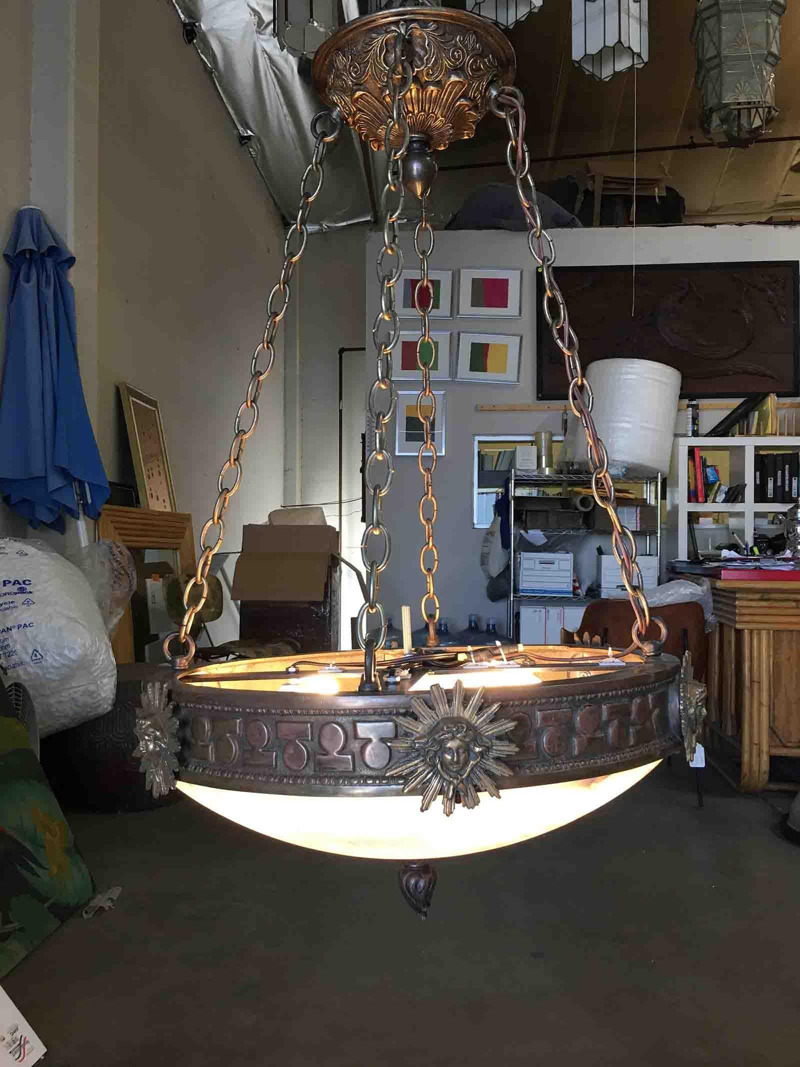 Wonderful bronze and slag glass Liberty chandelier. The Liberty chandelier is a very popular chandelier for commercial and residential use. It gives off an alabaster amber glow and sets a warm ambiance throughout the room.

addx1
