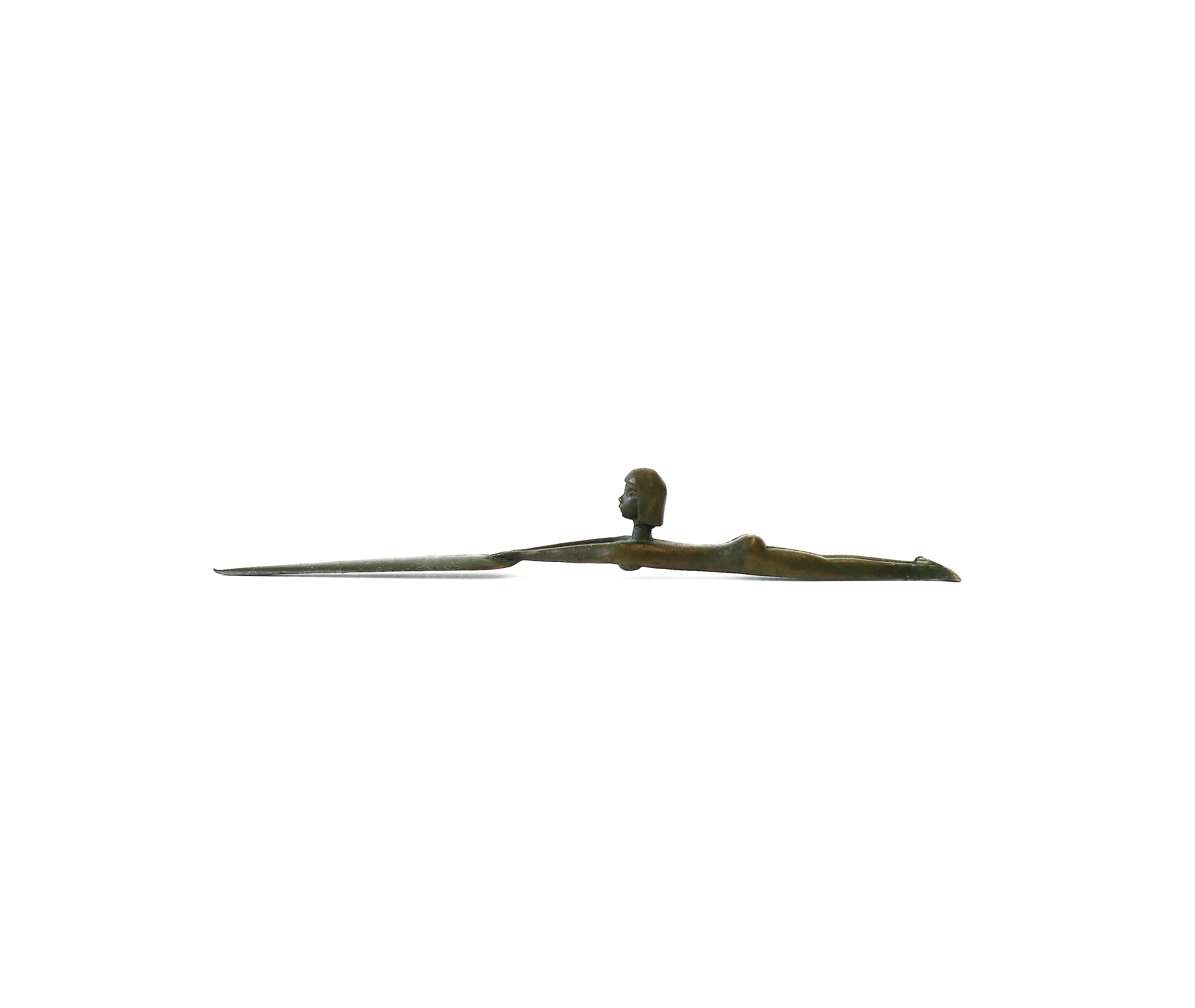 A solid detailed bronze female figurative letter opener; female figure is holding a board or shield. Piece is solid bronze with dark brown finish. Artist initials on underside as show in image #9. A great office/desk accessory. 

Measures: 1.25