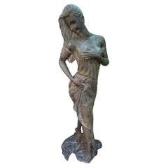 Escultura femenina de bronce a tamaño natural de un desnudo