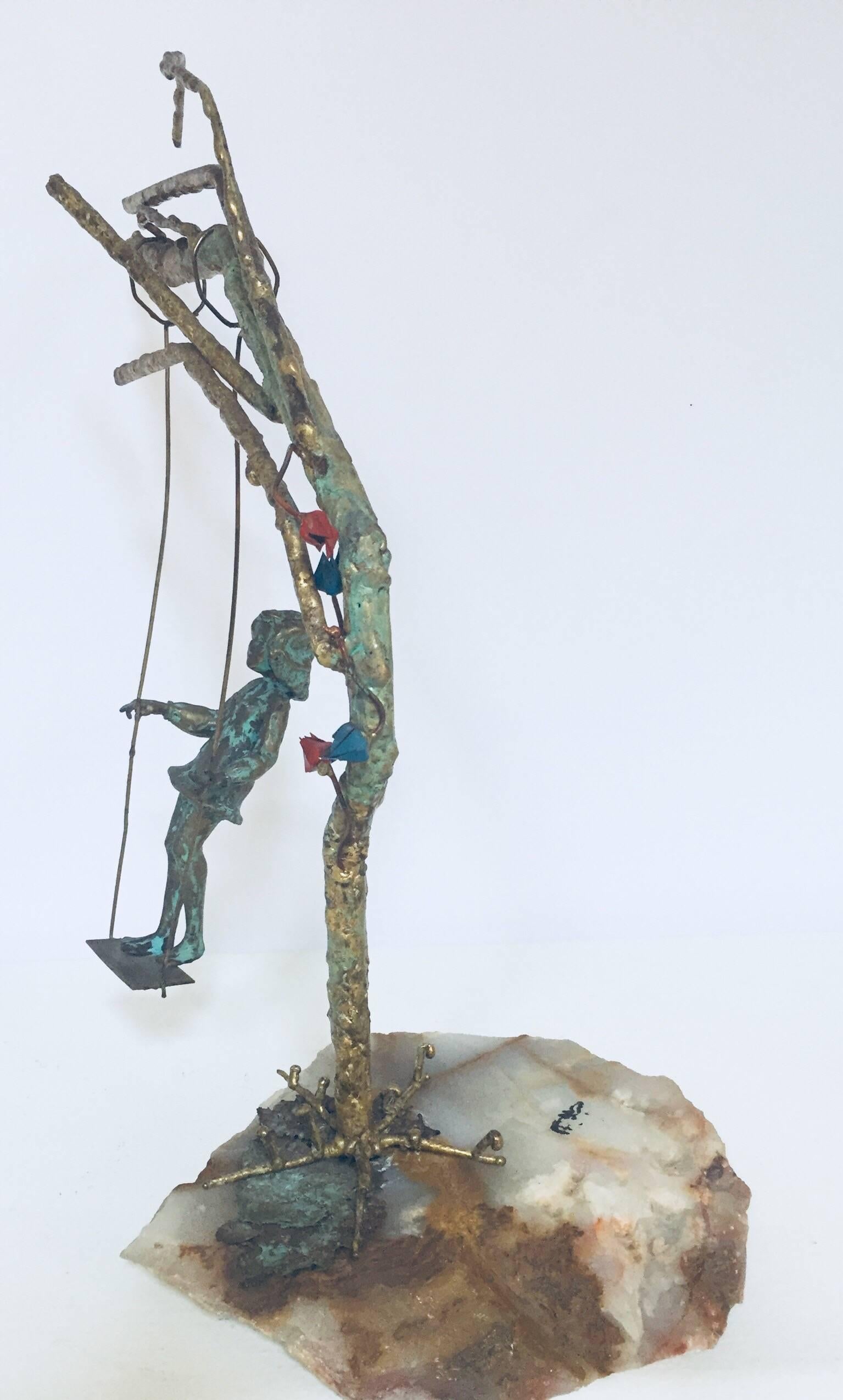One of a kind Metal Art tree sculpture 1971 sculpture by Malcolm Moran.
It depicts a bronze girl on a swing hanging from a tree branch that sits upon a geode base.
The sculpture is signed 