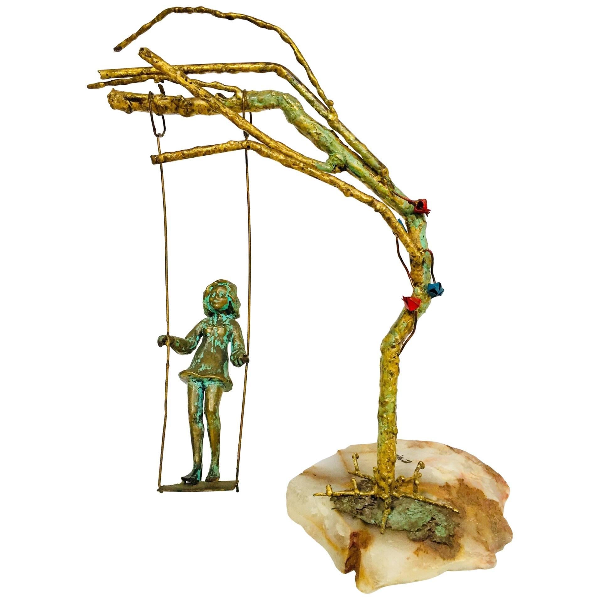 Bronze Figural Sculpted Girl Swinging from a Tree Branch on Marble Rock Base