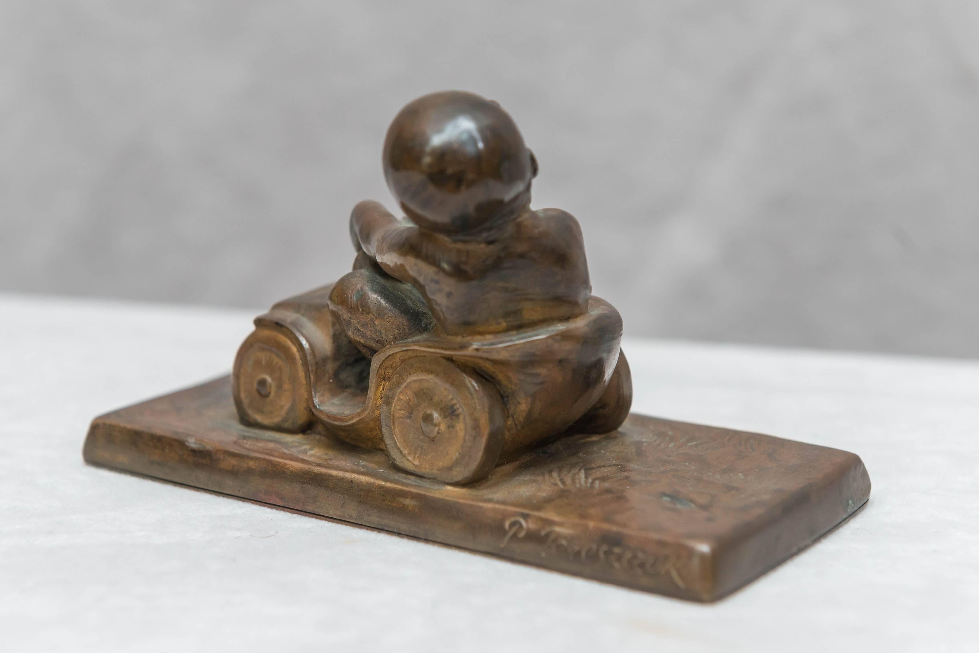 Bronze Figure of a Little Boy in a Toy Car, Artist Signed Tereszczuk, circa 1910 In Excellent Condition In Petaluma, CA