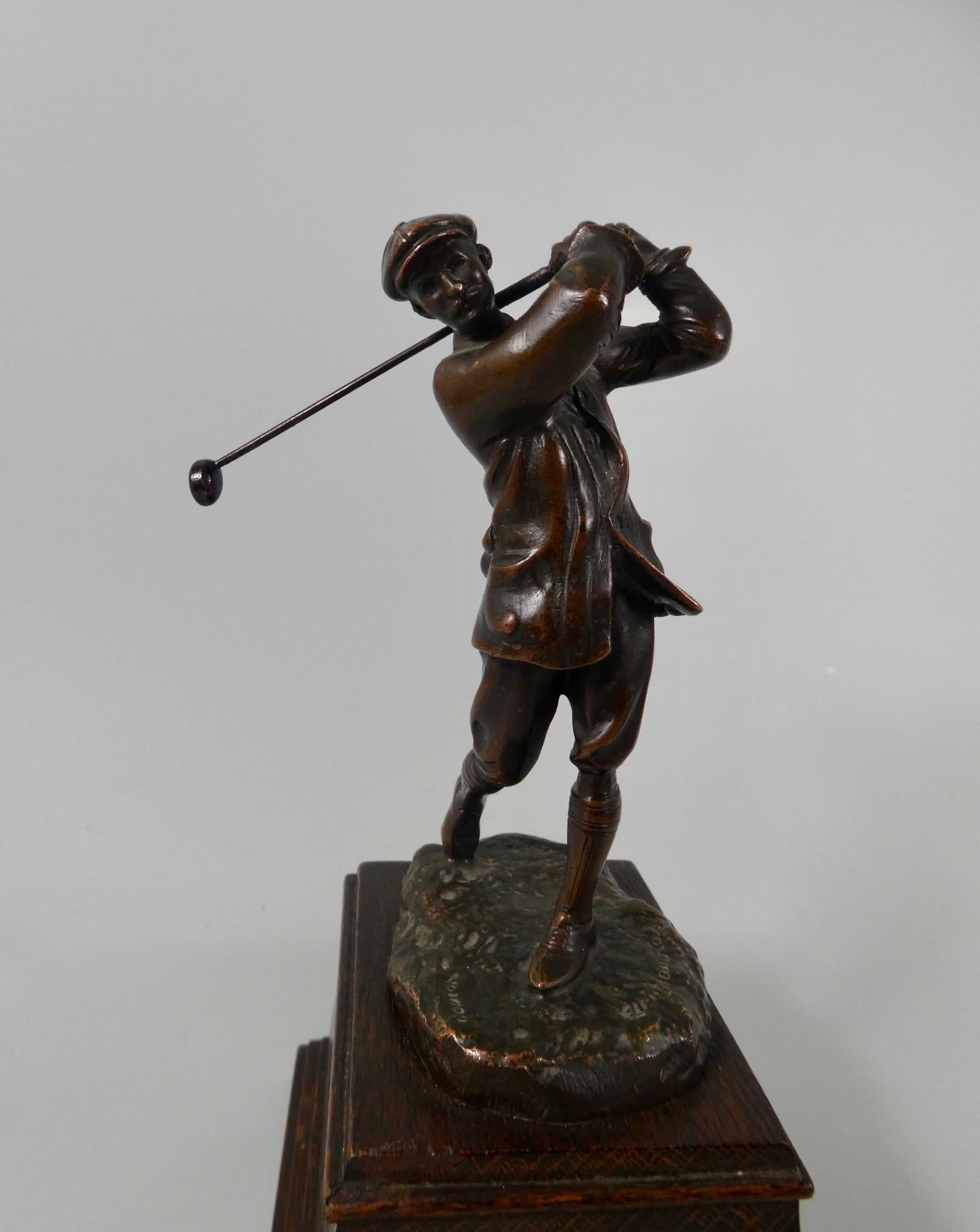 A bronze figure of the golfer Harry Vardon, modelled by Hal Ludlow, for Elkington and Co., c. 1920. Well modelled as the famous golfer, at the top of his back-swing. Standing upon a grassy mound base, and set upon its original wood plinth.
Signed -