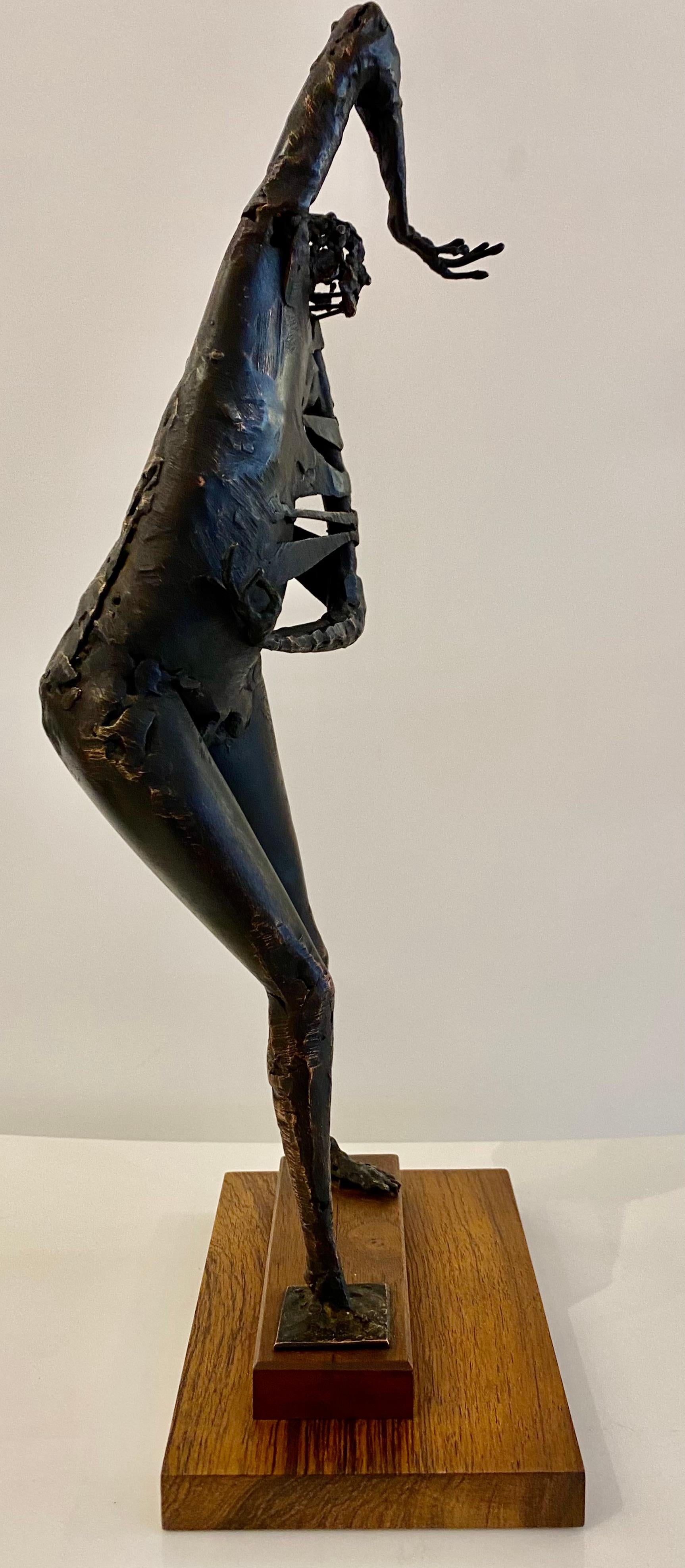This abstract bronze figure is by California artist Robert Stoller (1936-). Striking from a distance, the position and the texture of the figure stand out on this piece. The sculpture is patinated in a rich liver bronze finish and is mounted on an