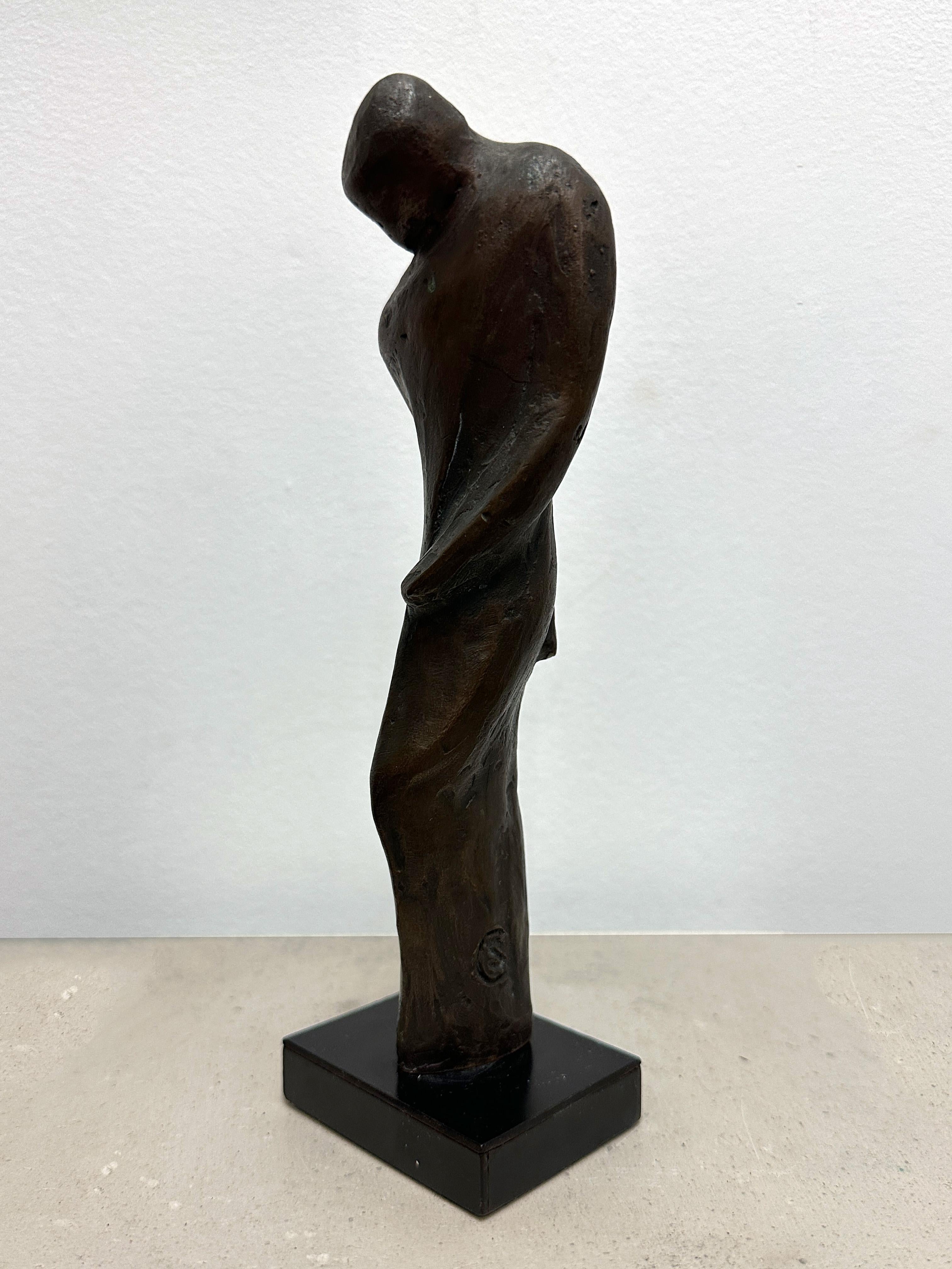 Bronze sculpture of a standing figure, by artist Caroline Stacey. In excellent condition. The dimensions are 2.5