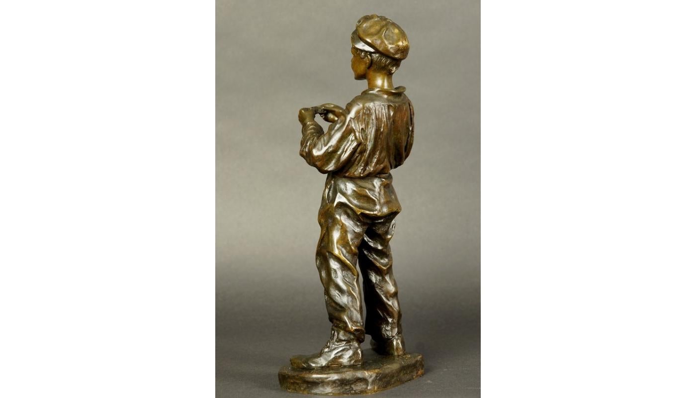 Spanish Bronze Figurine of Young Boy Rolling a Cigarette Jose Cardona 20th Century For Sale