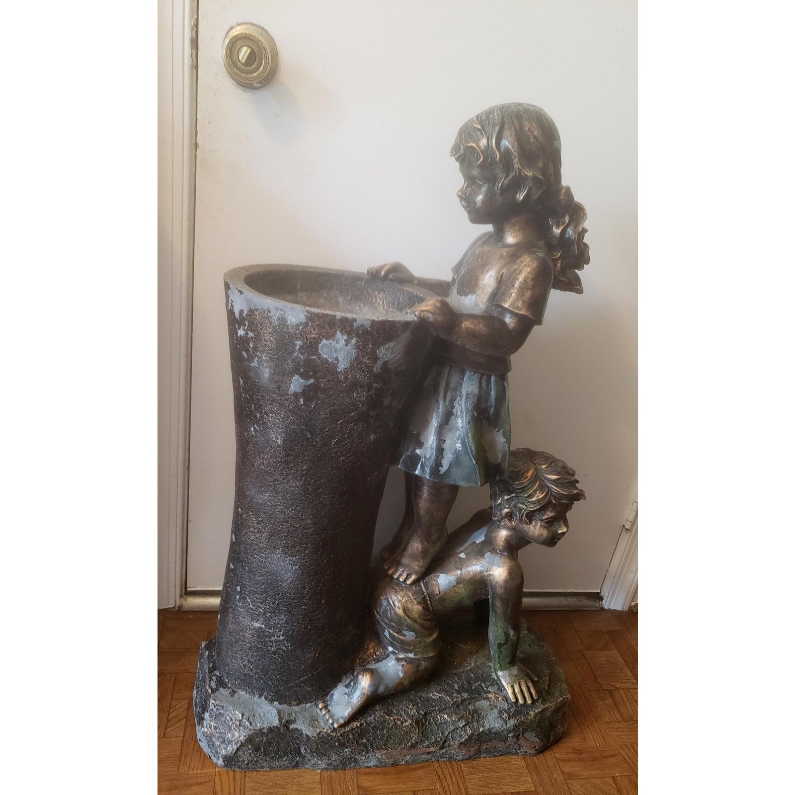 Vintage boy and girl water fountain statue.
Boy & girl water fountain statue.
Made out of resin and fiberglass materiel with bronze finish. Some finish loss as visible on picture due to age. No structural damage. 
Dimensions:24? in width x 10? in