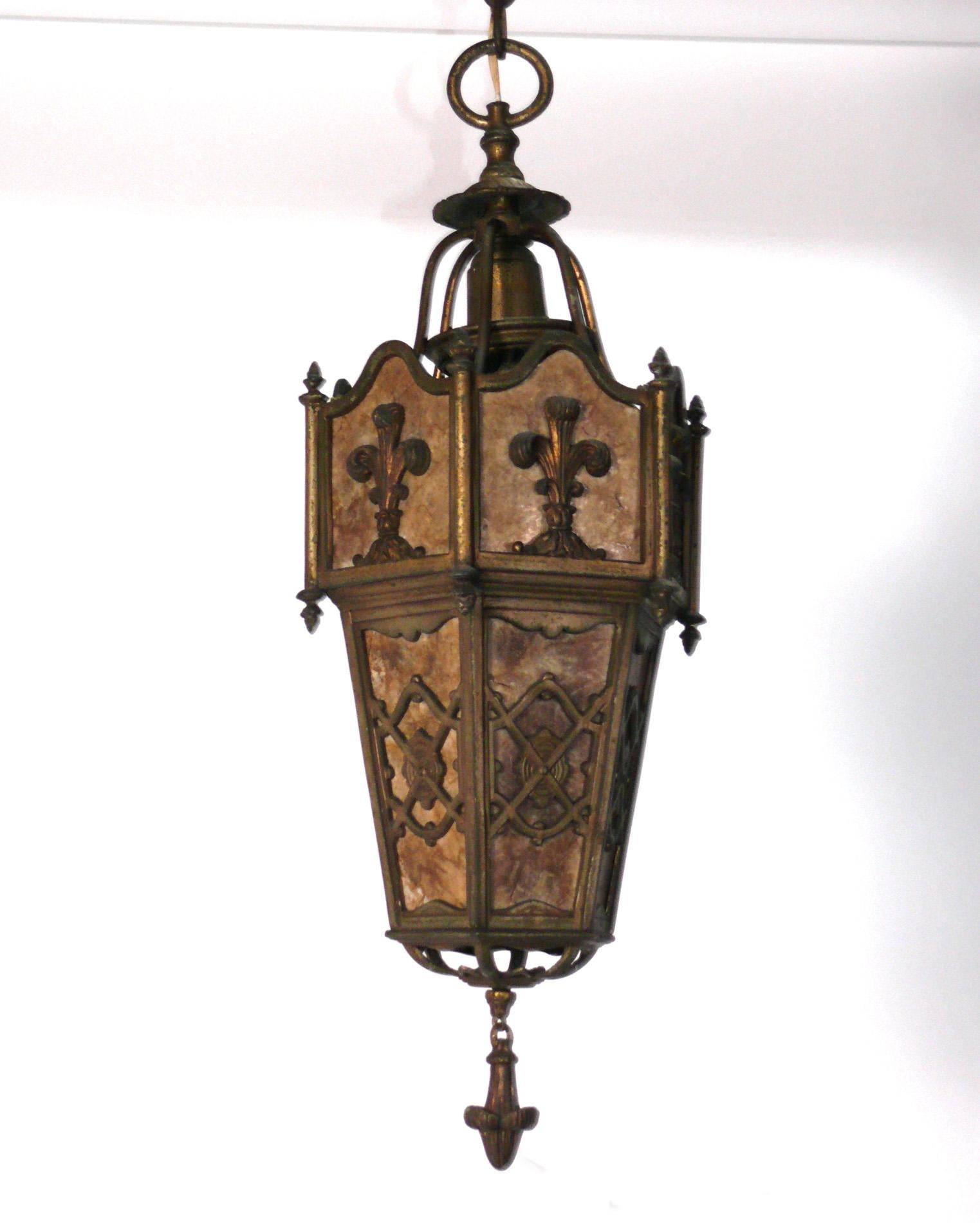 Bronze Finish Mica Pendant lantern or chandelier, probably English, circa 1930s. Would look great in the foyer or hallway of an Arts and Crafts or Spanish Revival home, as the mica gives off a warm glow. It has been rewired and is ready to mount.