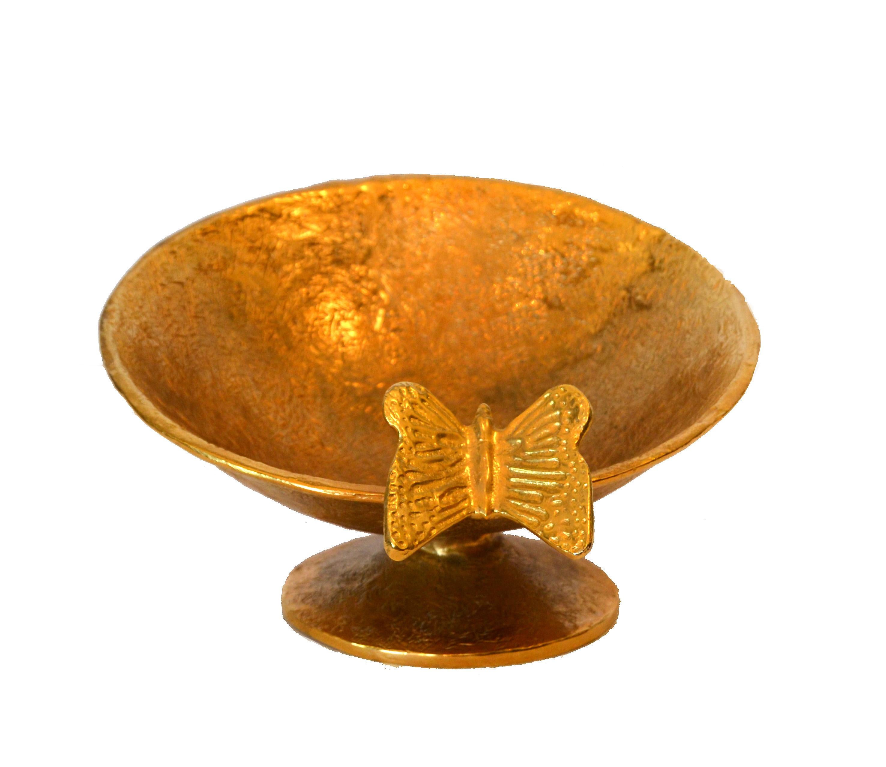 Bronze footed bowl with a butterfly decor.