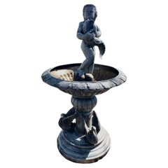 Fontaine en bronze avec garçon