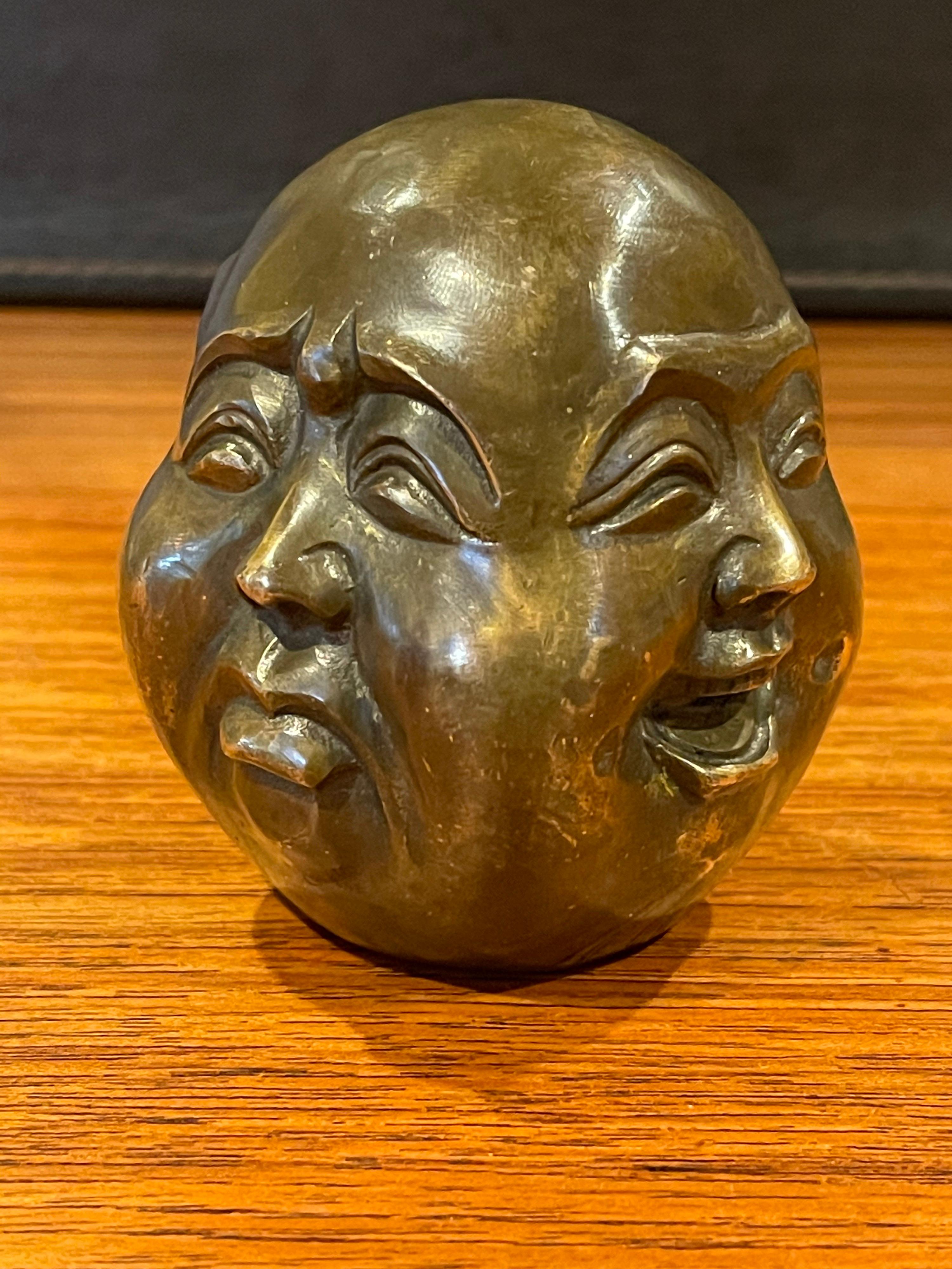 4 faced buddha head