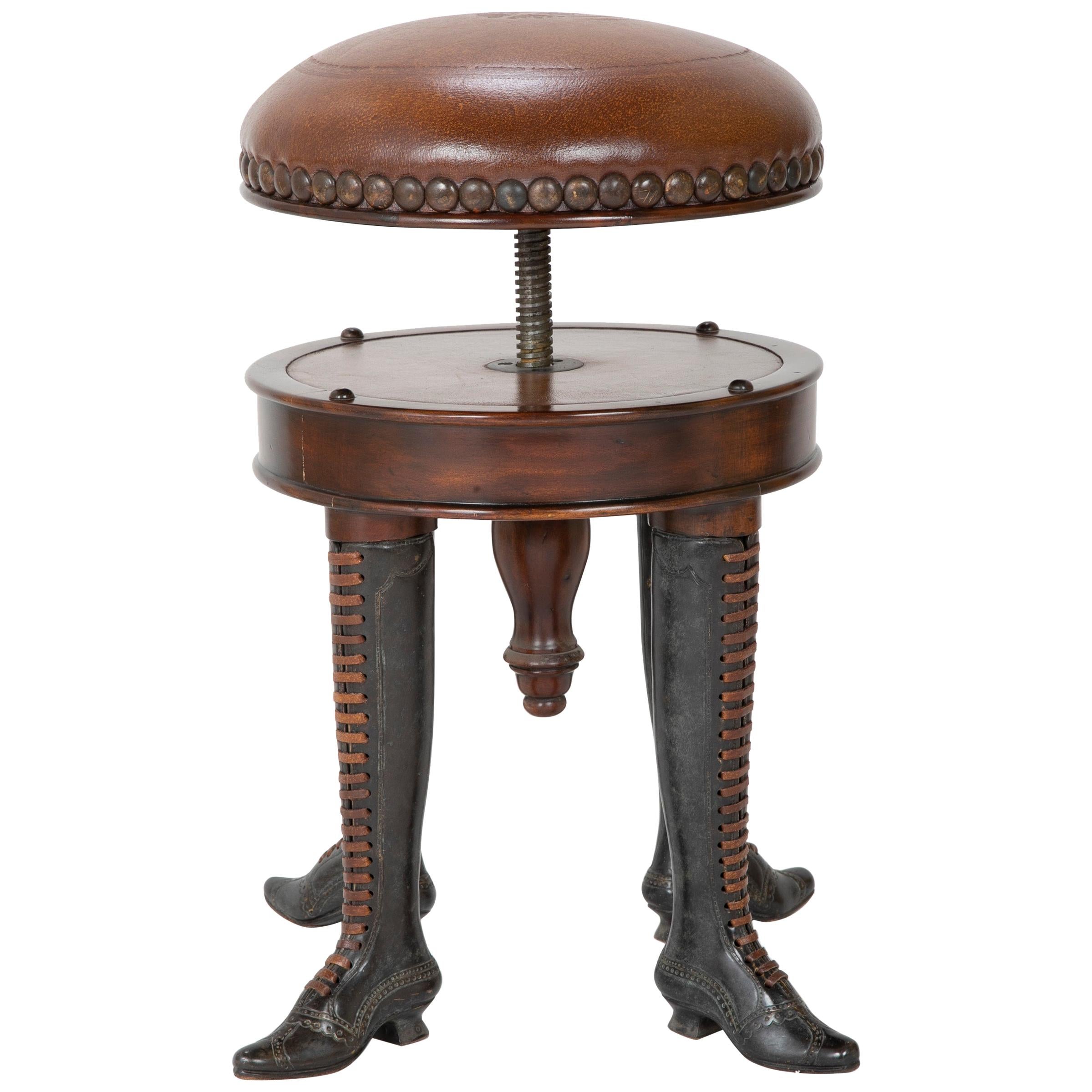 Tabouret tournant réglable à quatre pieds en bronze avec siège rembourré en cuir