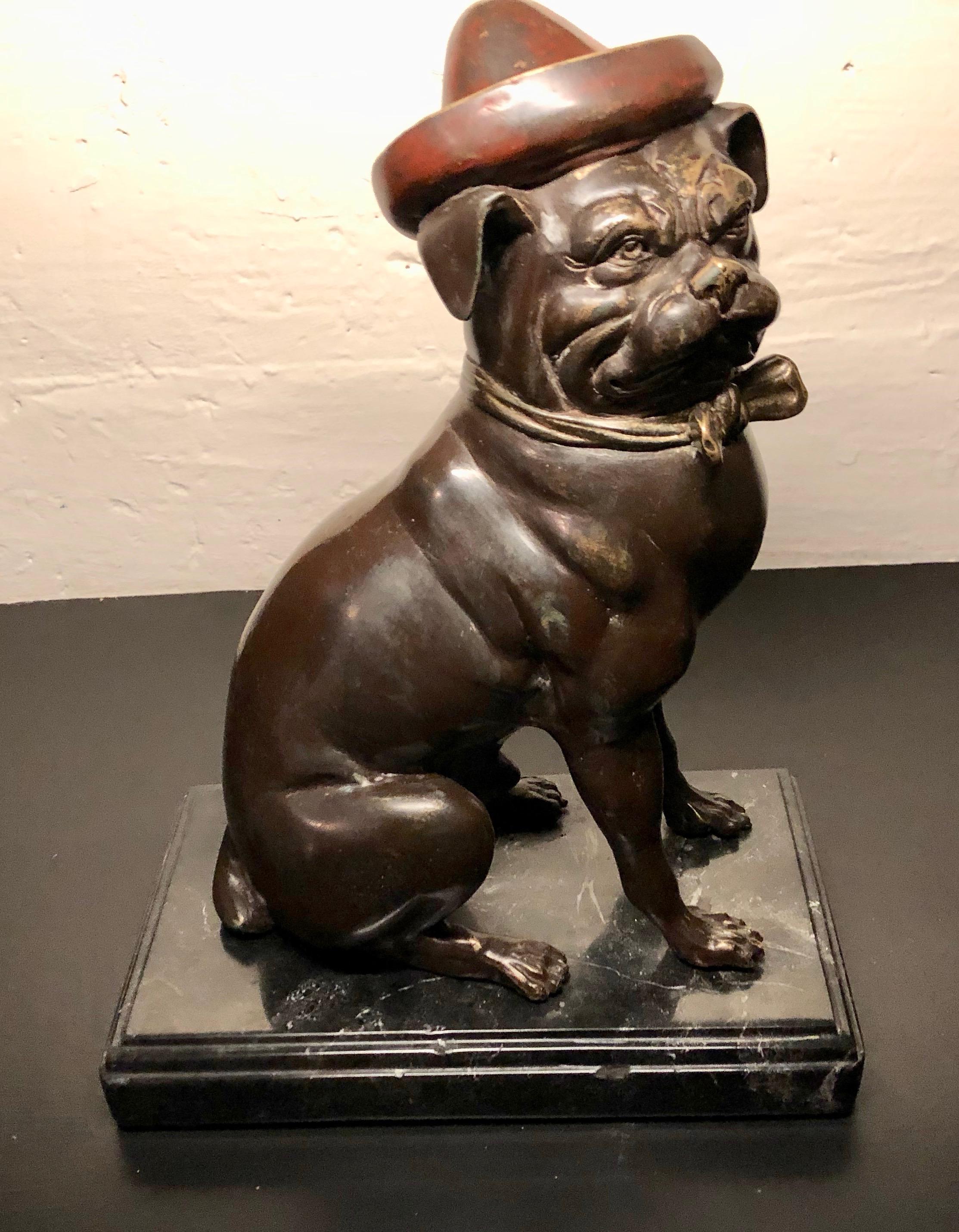 French Bulldog sculpture in bronze with cold painted enamel color. Caricatures are often seen of these unusual and highly collected dogs. This one sports a hat and bow tie. They find favour in the homes of so many animal lovers. I fell in love with