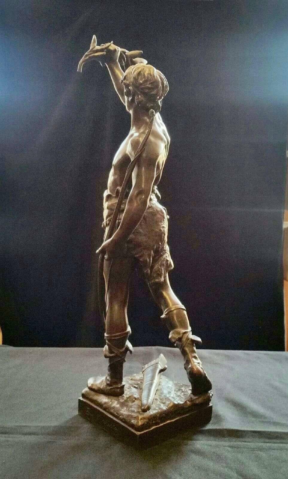 This signed and prominent masculine bronze 
