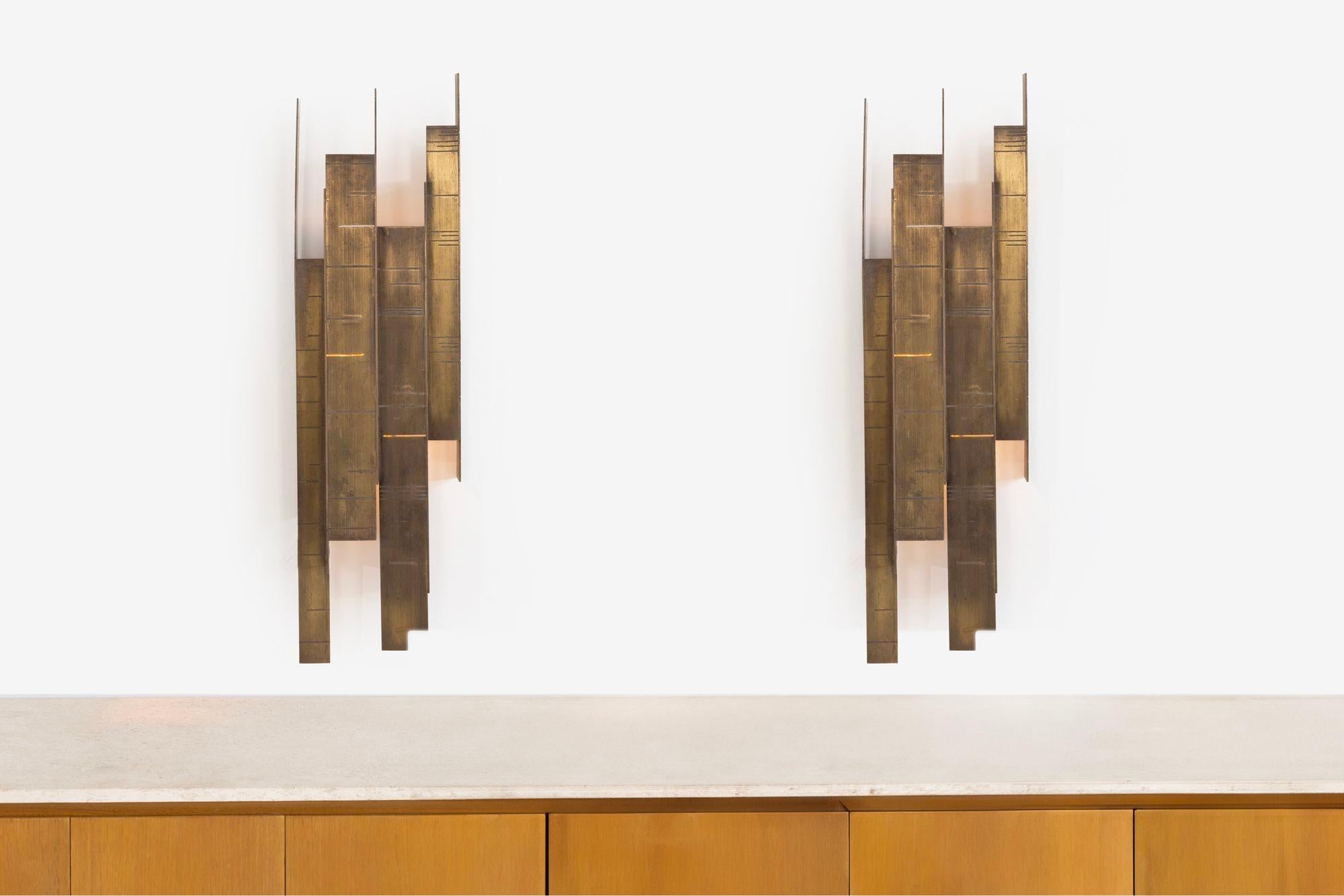 Bronze Geometric Brutalist Wall Sconces, features up-and-down light sources, solid metal, made well.

DIMS:
38