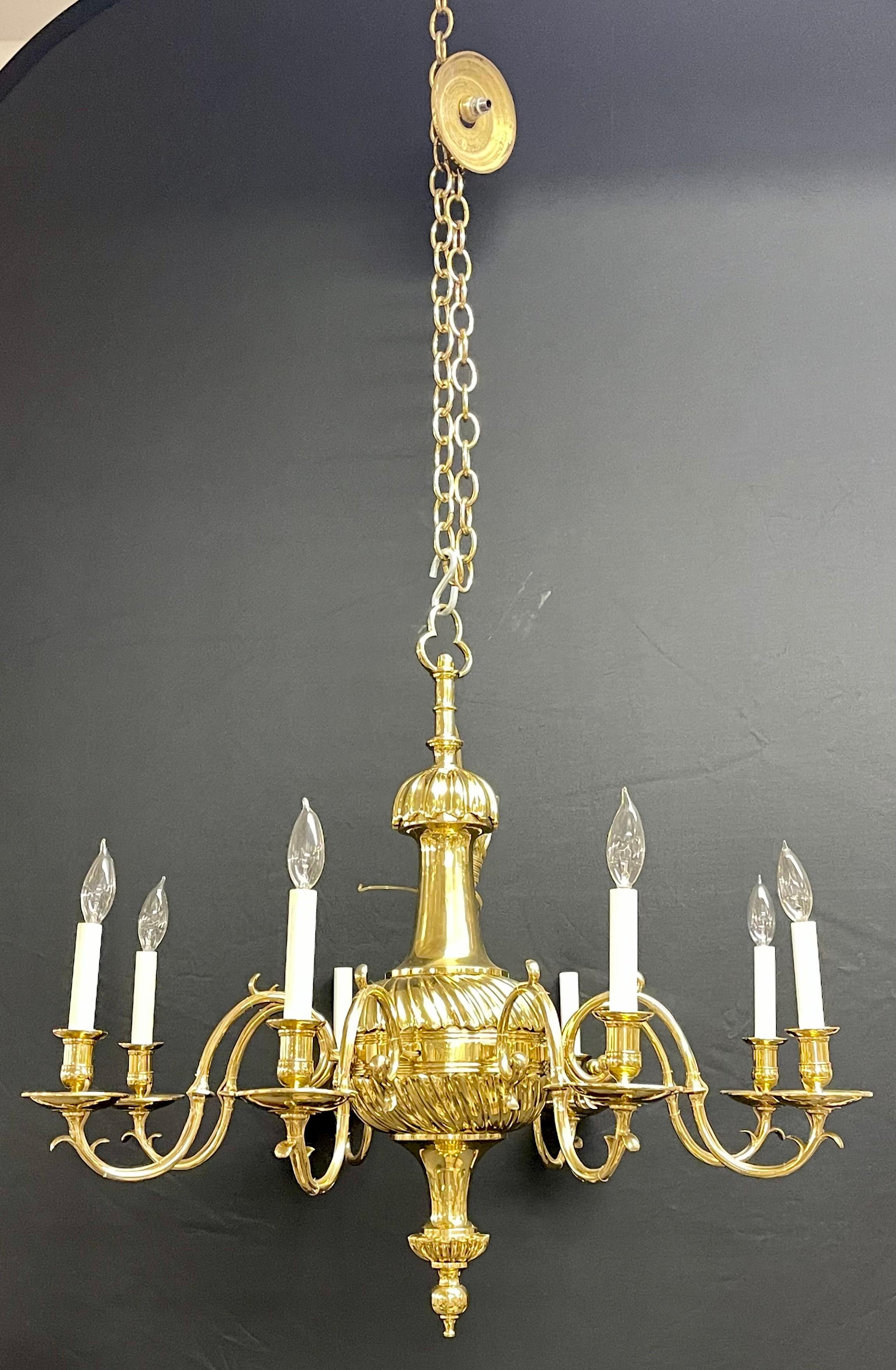 Bronze Georgian style Chandelier having eight lights. A finely cast thick short and wide frame supporting Eight scrolled arms each having a single light. Matching canopy and 68 inch brass chain. Newly wired.

H30