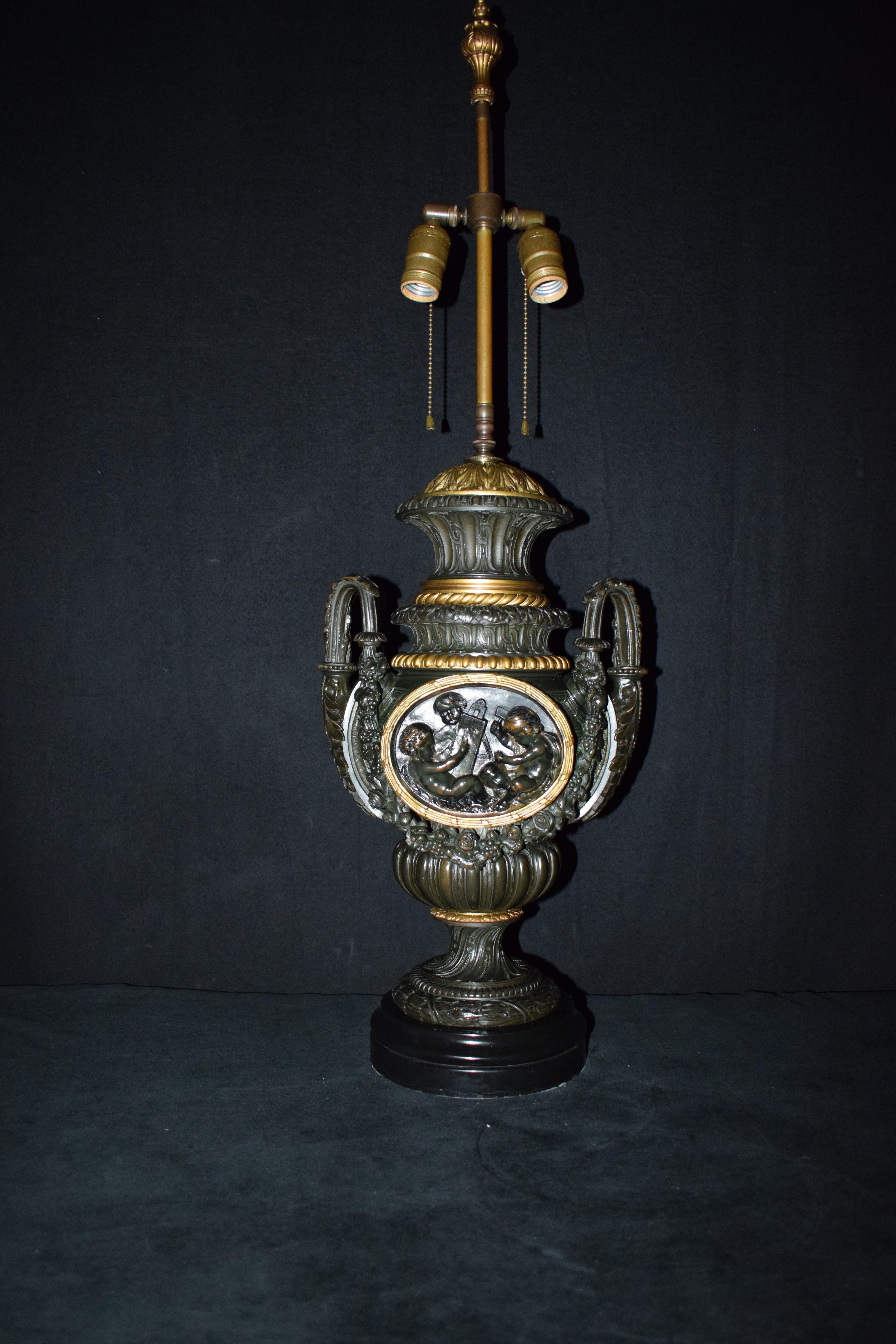 A superb bronze and gilt bronze lamp table lamp base. Black marble plinth and lamp height of 19