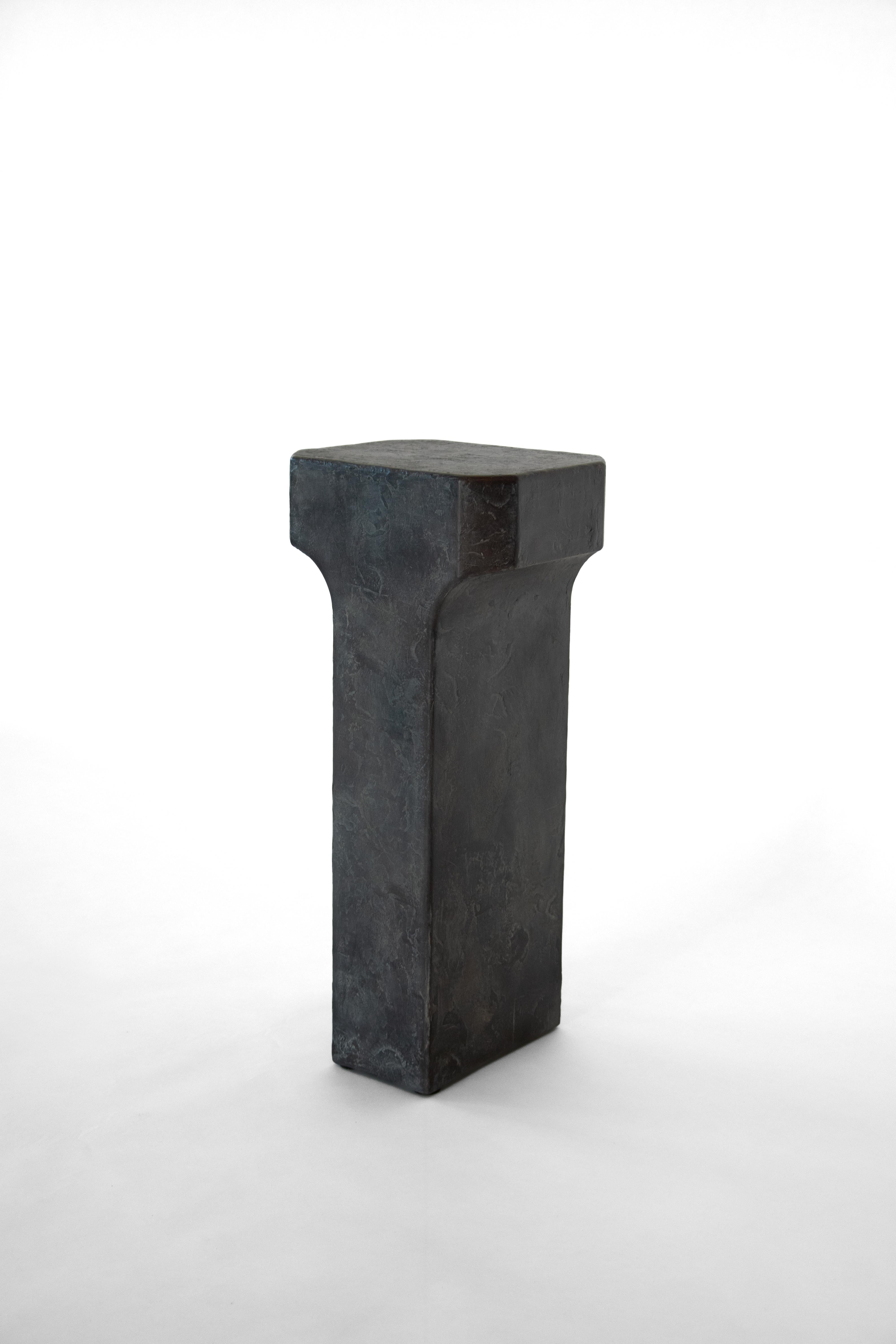 Bronze Grey Patina Arch Side Table by Eichkorn
Dimensions: W 30 x D 30 x H 67 cm
Materials: Cast, patinated bronze.

Arch is a solitary piece – cast in solid bronze, grey-patinated, and finished with a textured surface. Its tactile quality is raw,