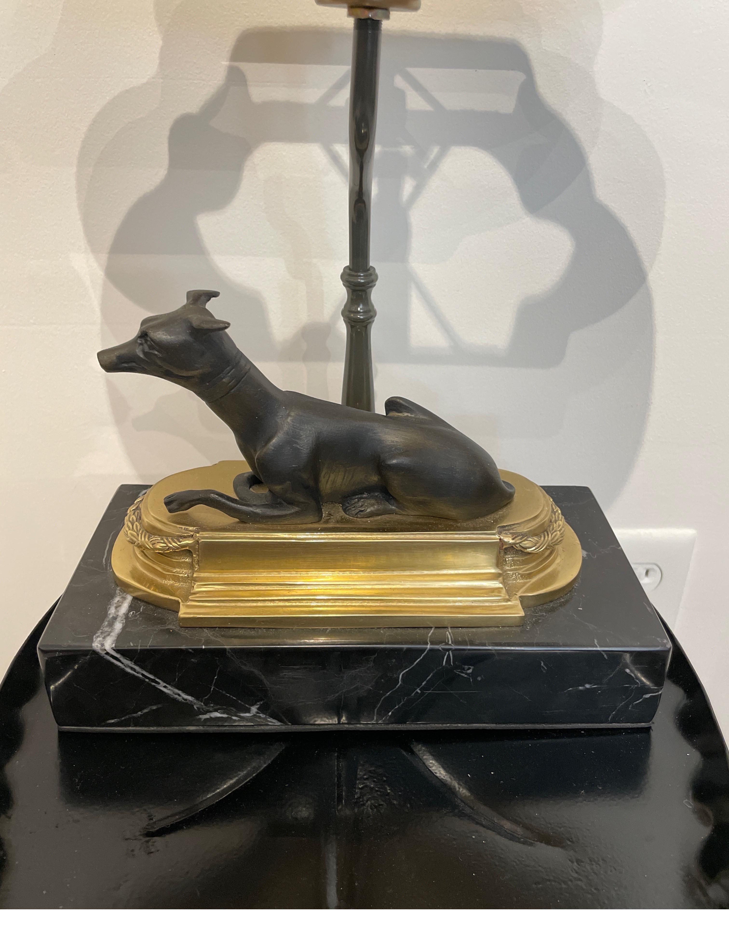 Reclining bronze greyhound table / desk lamp on brass & marble base with silk shade. This neoclassical lamp with brass wreath finial will add class to any setting.