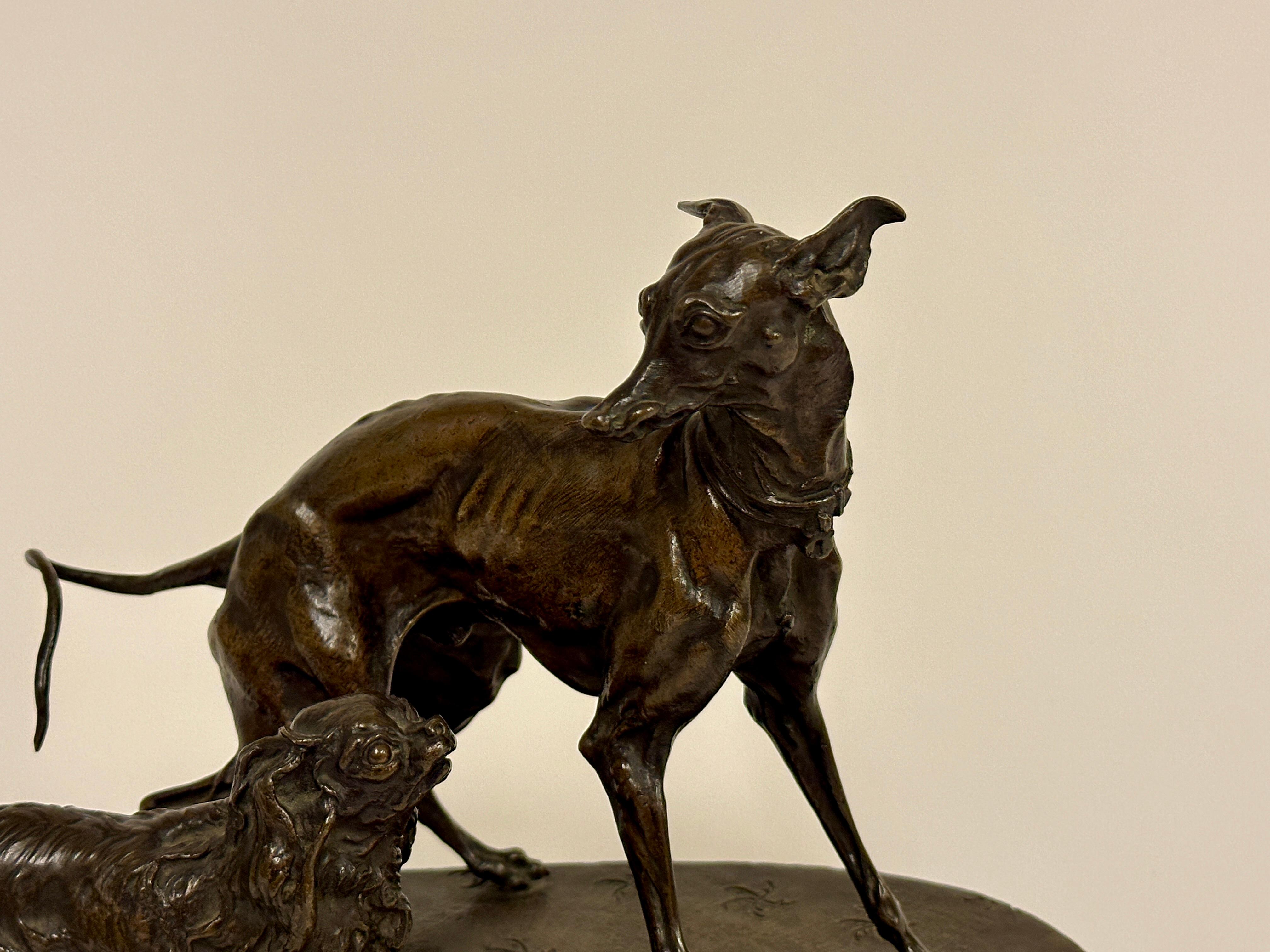 Groupe en bronze d'un Whippet et de chiens pékinois, avec l'inscription P.J. Mene.