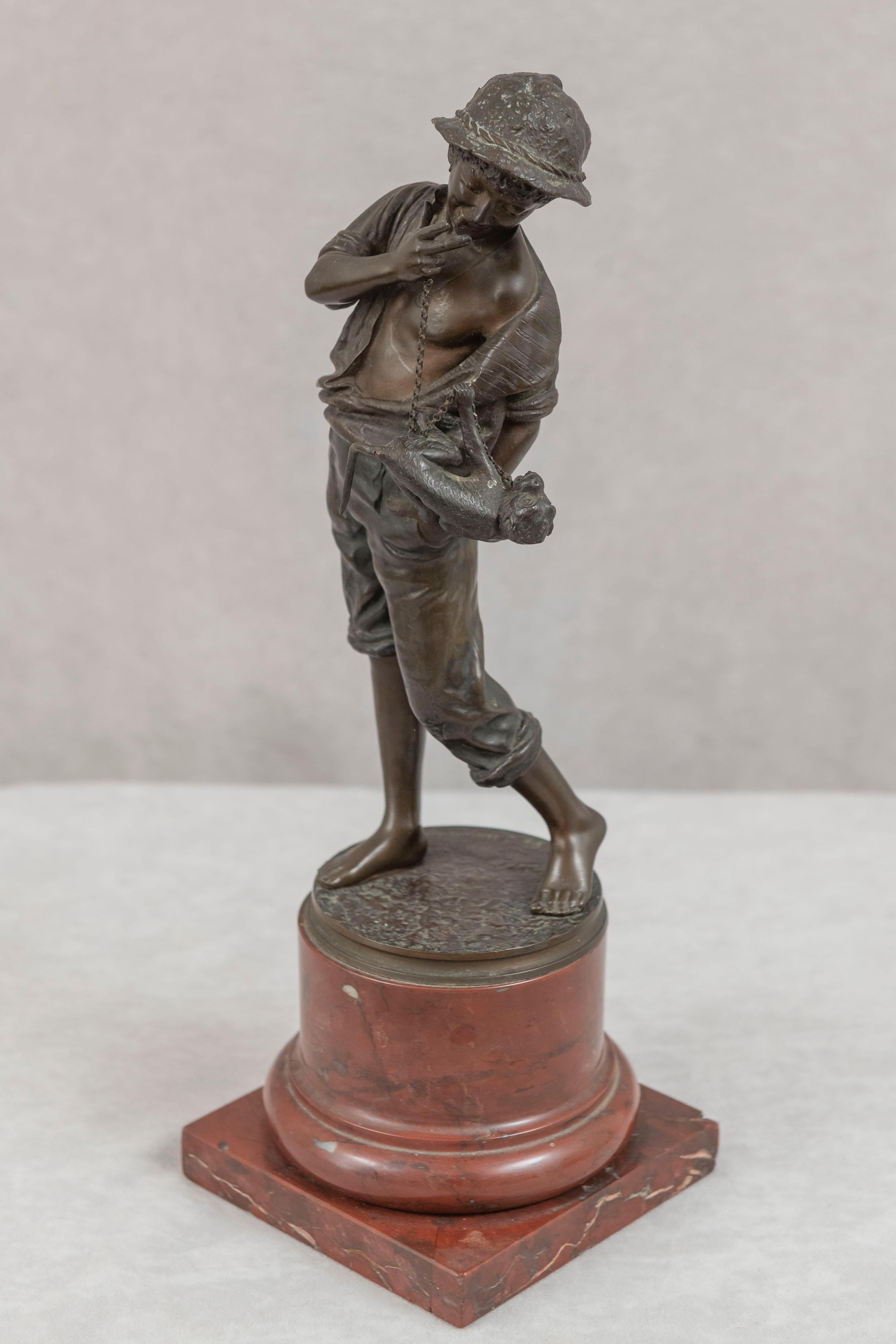 This very whimsical bronze features a young street kid, cigar in hand, and monkey on a chain in the other hand. A scene that should inspire a smile. Sculpted by the Danish artist Carl Theodore Wegener (1865-1935), and cast by the noted German