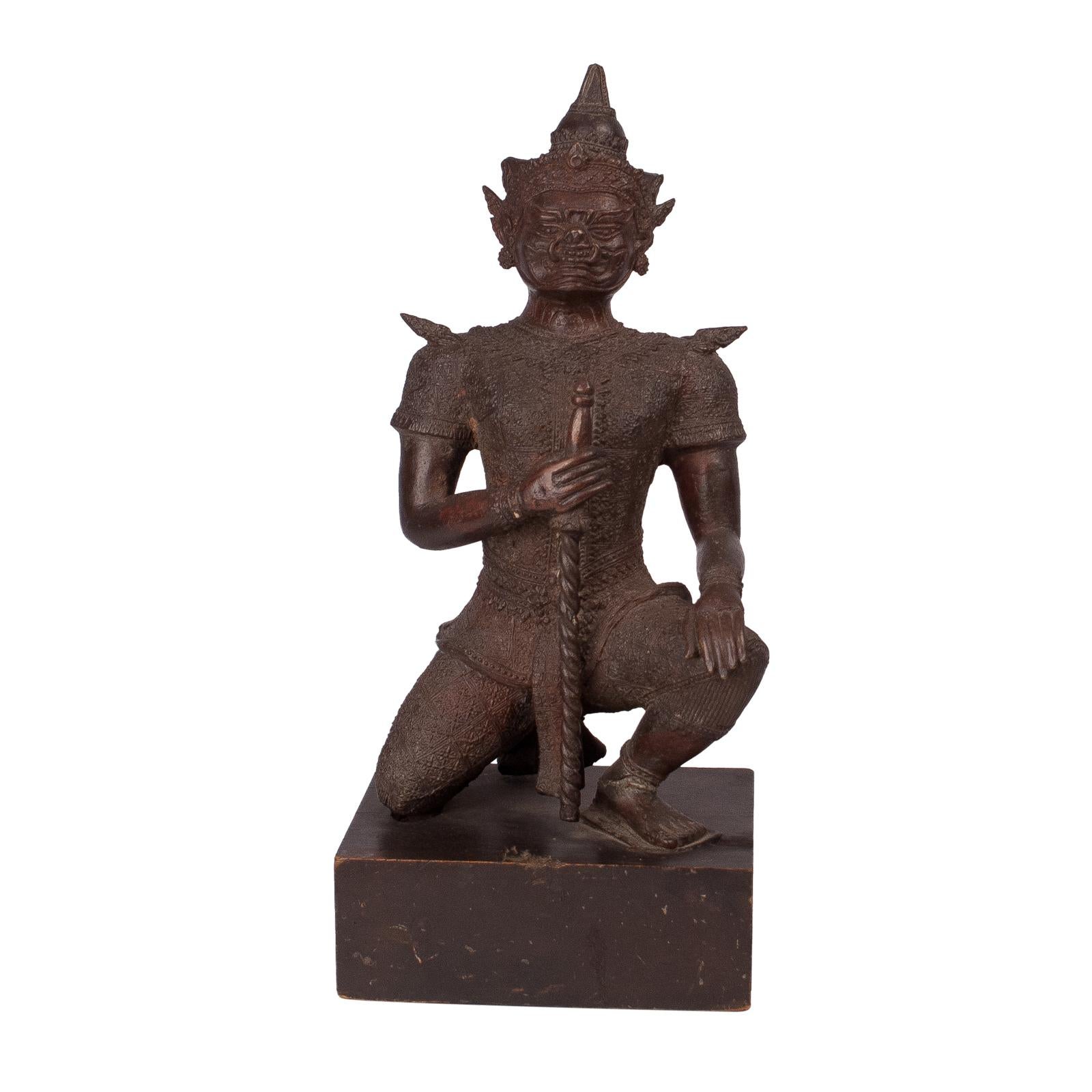 A mid-19th century Thai bronze figure of a temple guardian on a later stand, circa 1850. Ex-Collection of Xanadu, San Francisco.