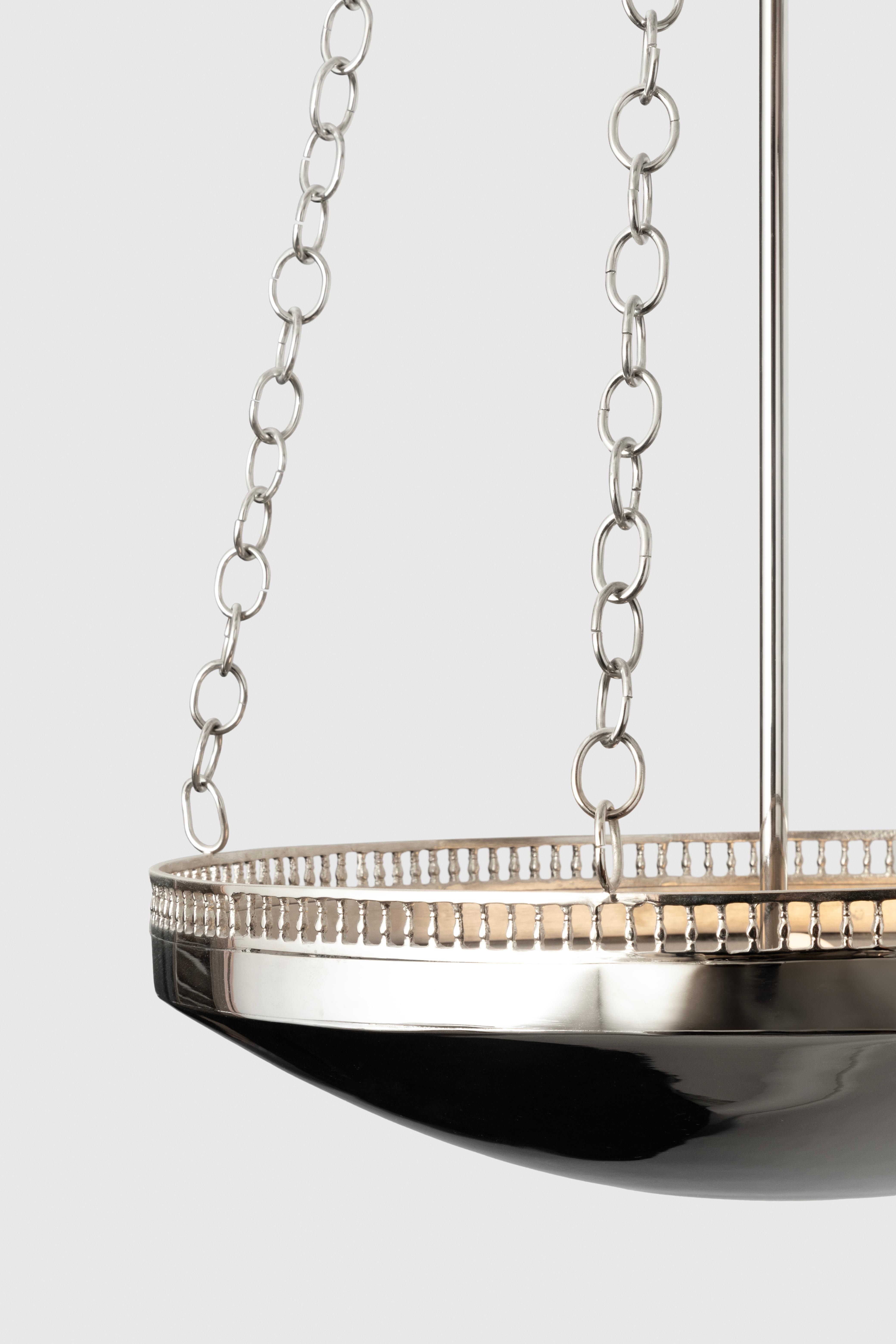 The Fernanda Dish Lamp is a refined and elegant pendant dish light, suspended from four chains from a crown canopy. 

It was designed by Fernanda Loyzaga and launched at the end of 2023. Its elegant lines and balustrade make it the best option for a