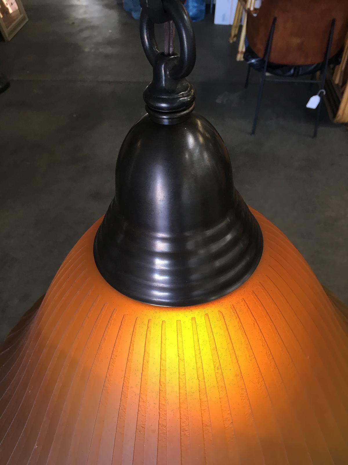 American Bronze Hanging Lamp with Amber Glass Shade For Sale