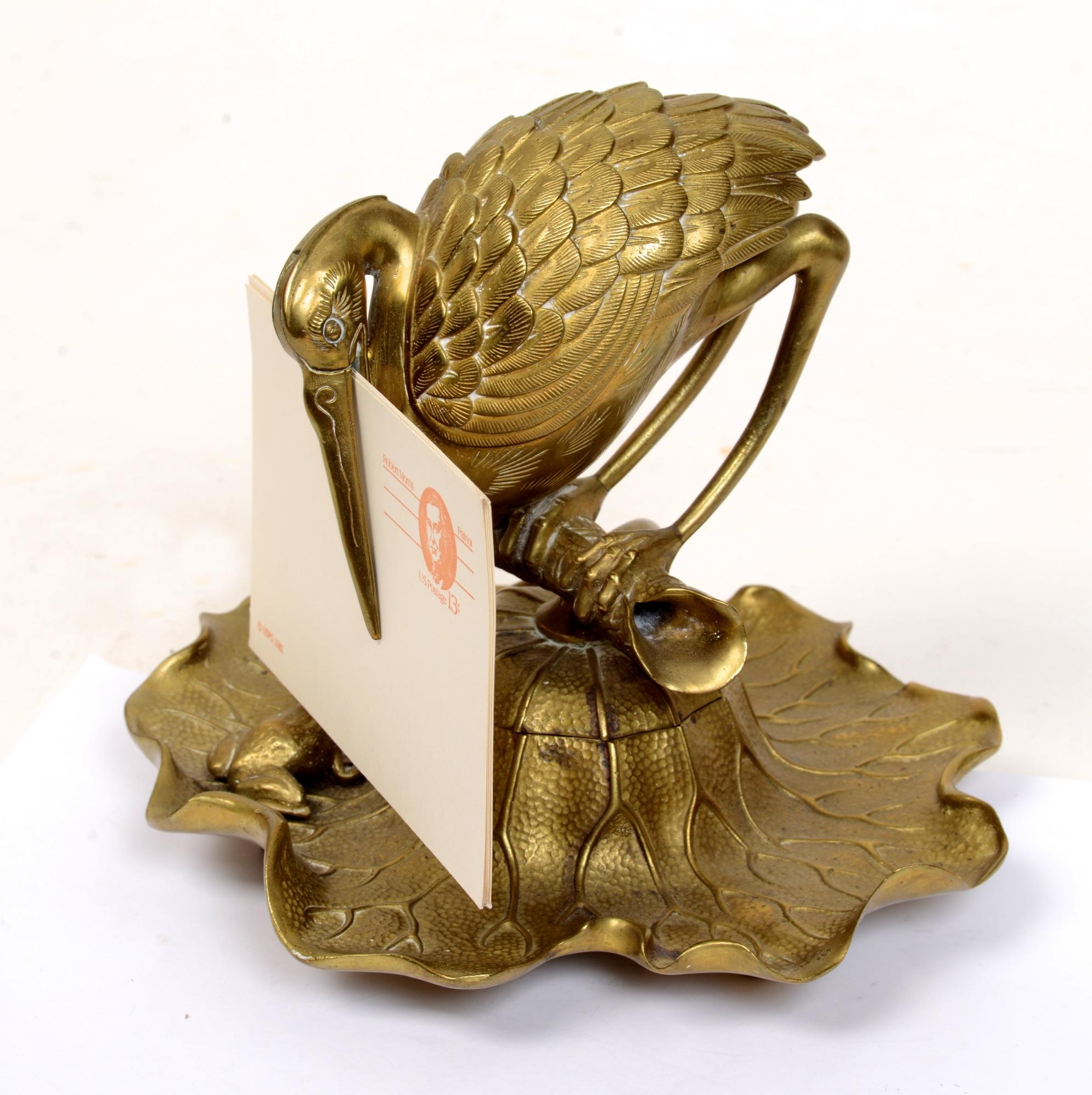 Bronze Heron & Frog Lily form inkwell, with an articulated hinged mouth letter holder. The heron perched on an open branch swivels to reveal an ink pot. The lily pad base pen holder with a seated frog, no visible markings. This form was seen in the