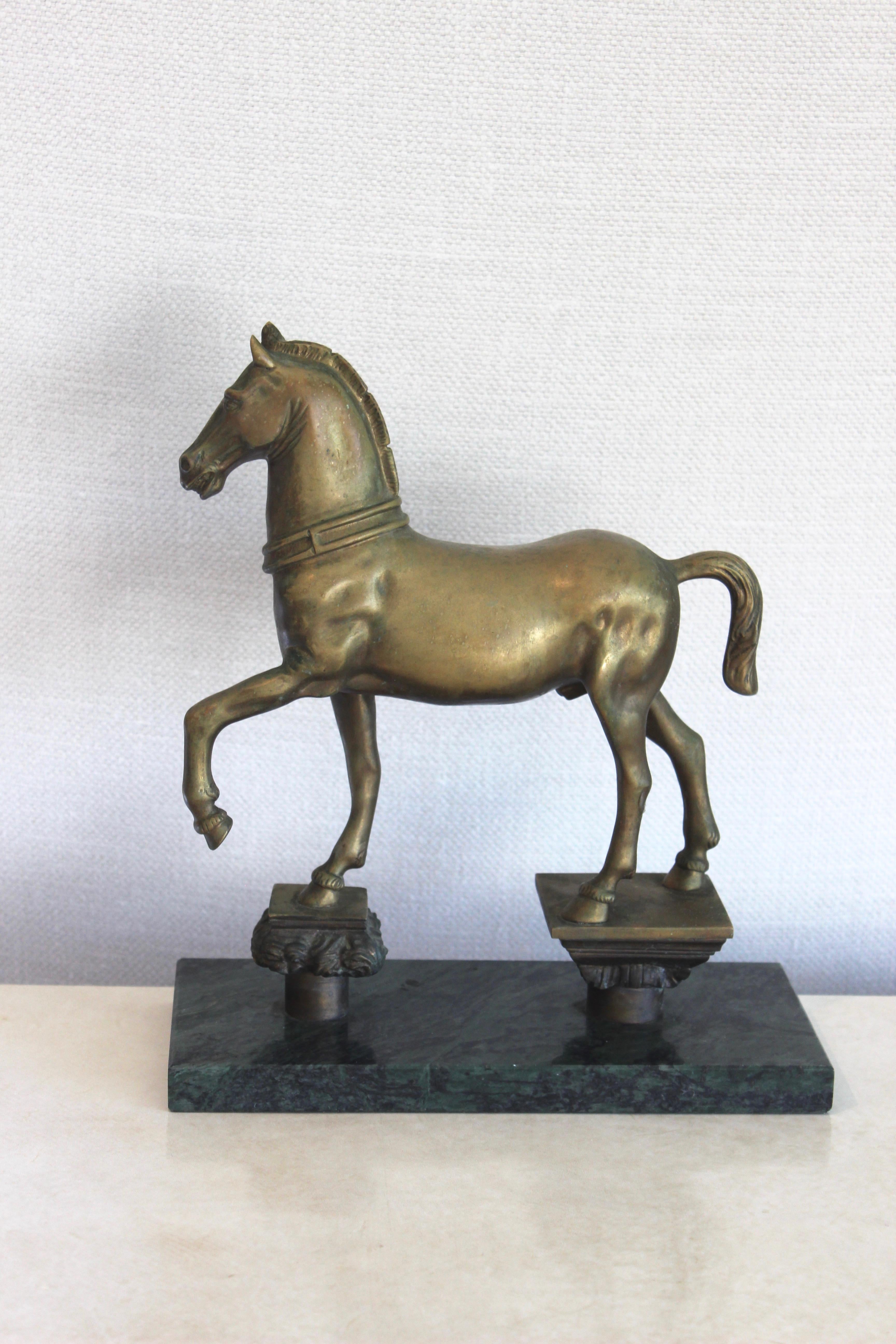 Bronze horse sculpture on green or Verdi marble base.