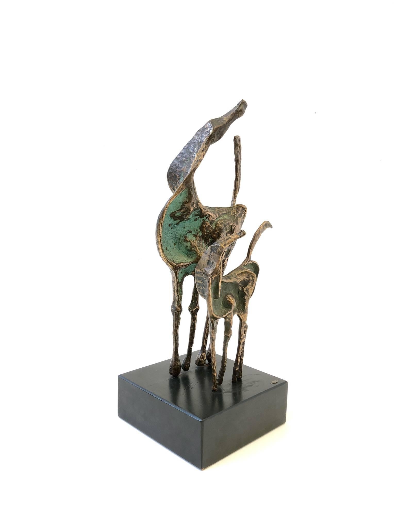 A beautiful 1970s cast bronze horses sculpture by renowned designers Curtis Jerè.
The sculpture has a beautiful patina and its mounted on a wooden lacquer base. 
The sculpture is signed and dated 1970.

Dimensions: 23.25” high 11” wide 9”